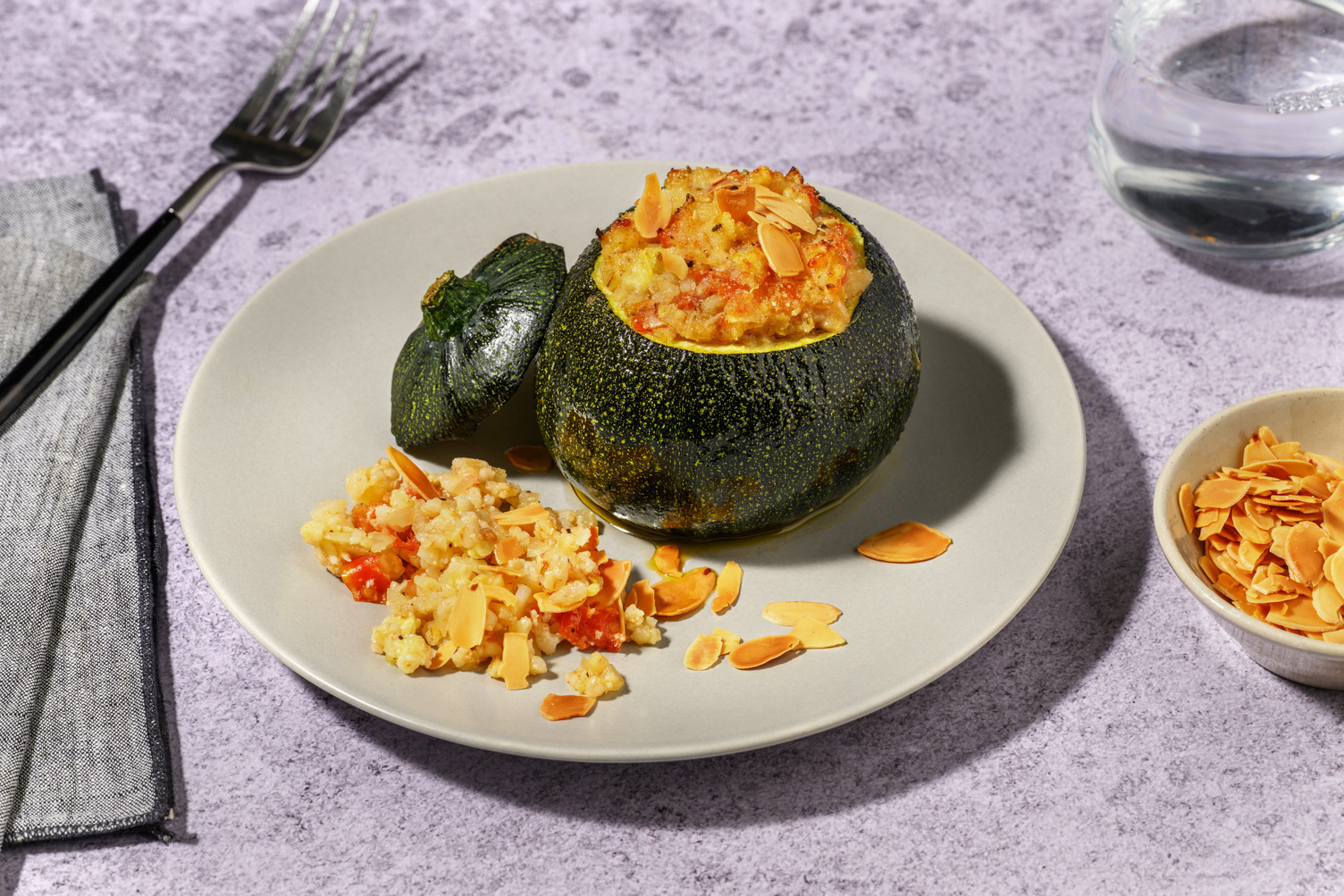 Zucchine tonde ripiene d'orzo e pancetta