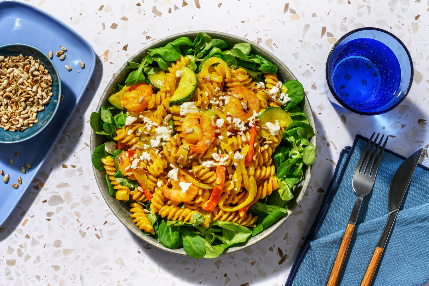 Fusili met scampi's in romige currysaus