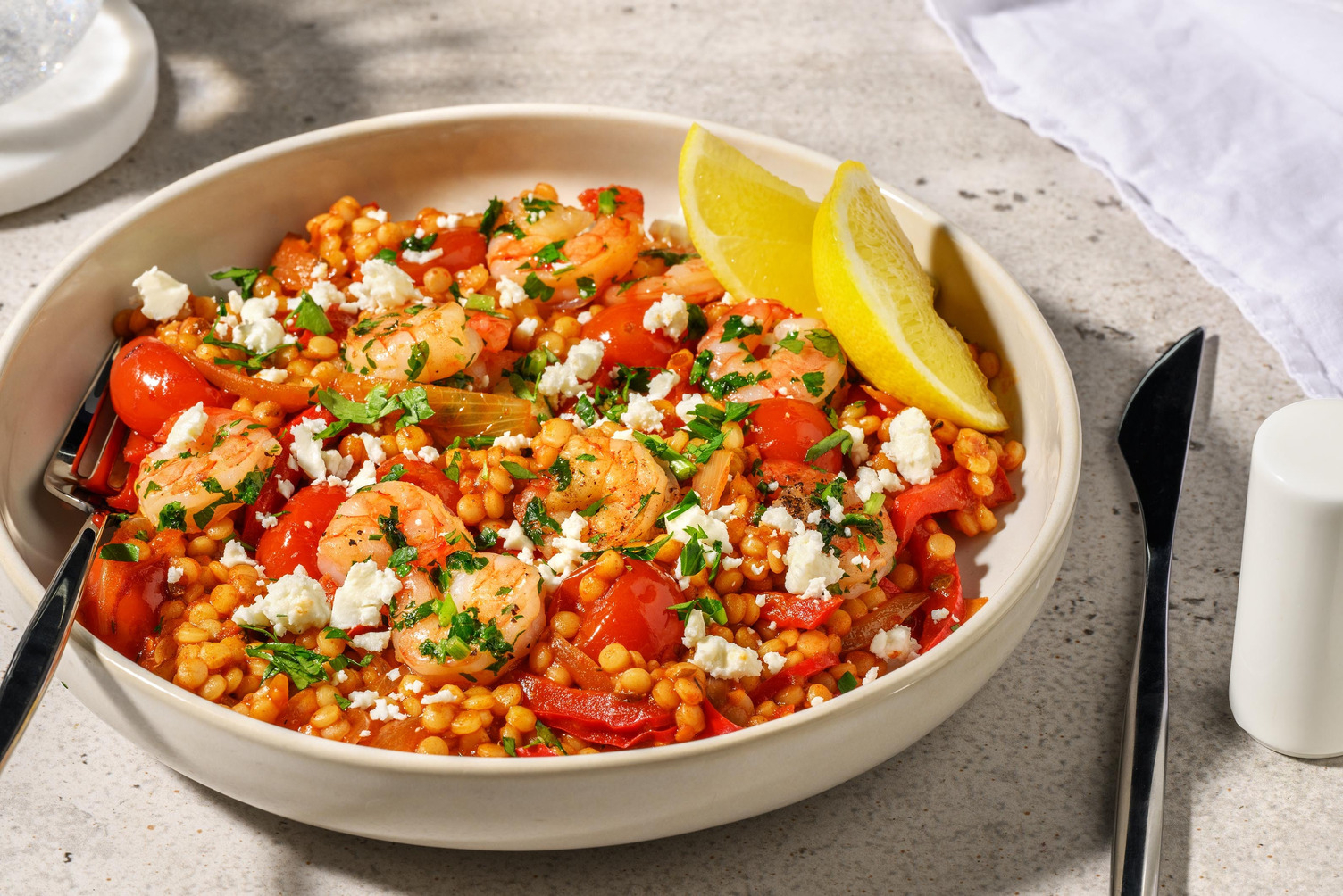 Garnalen met parelcouscous in cherrytomatensaus