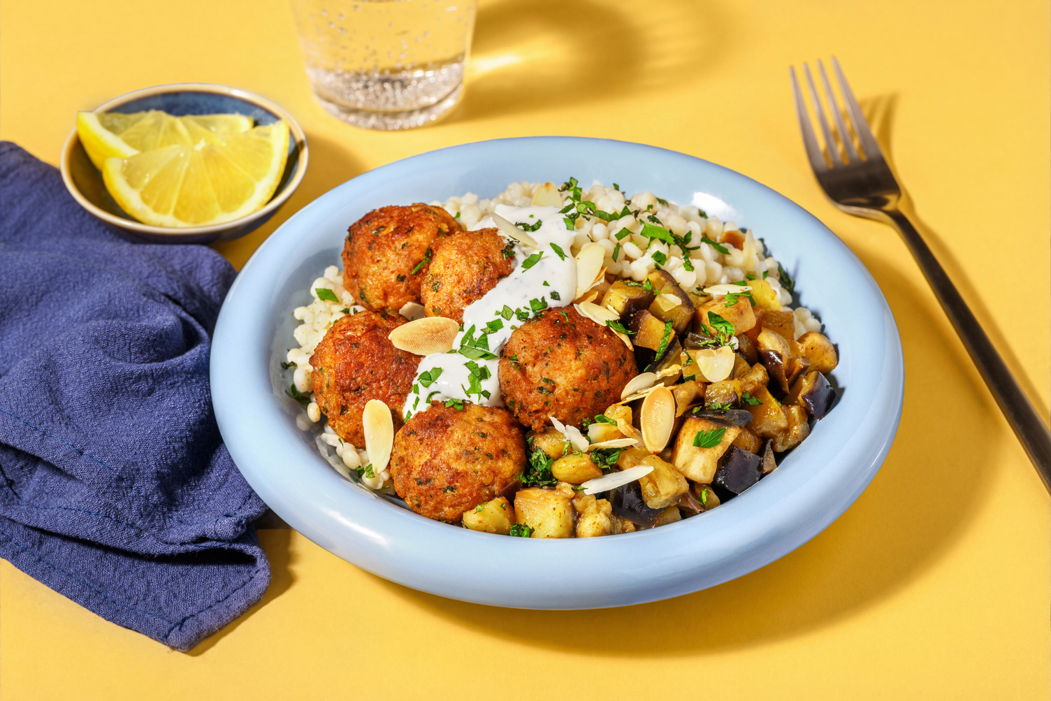Boulettes de porc épicées & couscous perlé