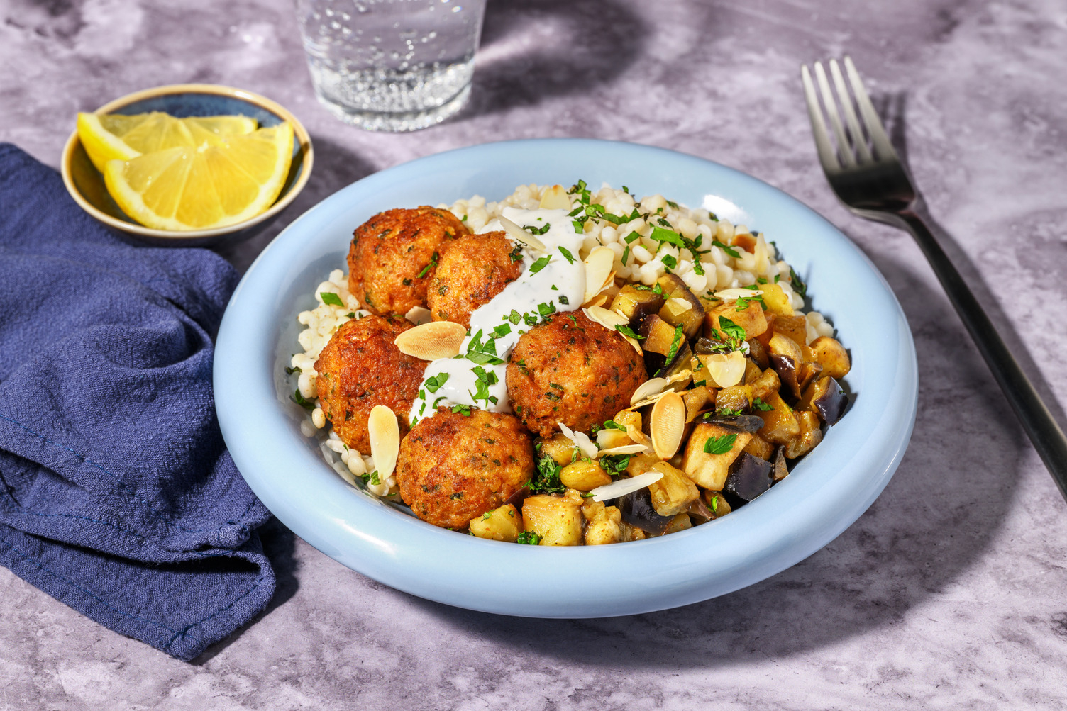Boulettes de porc épicées & couscous perlé