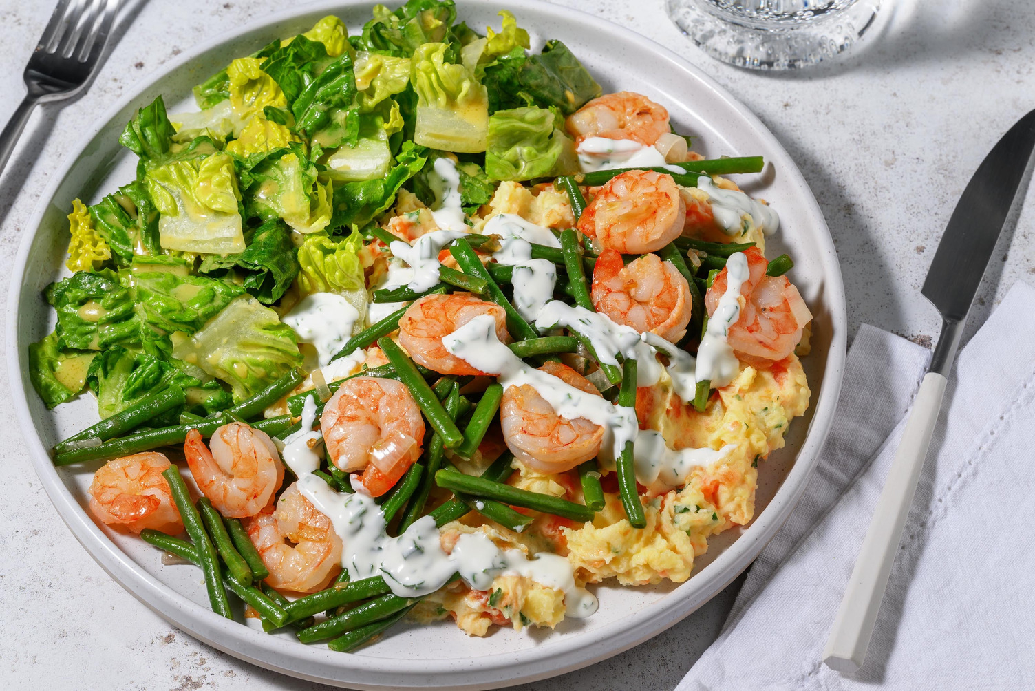 Crevetten auf Kräuter-Rüeblistock