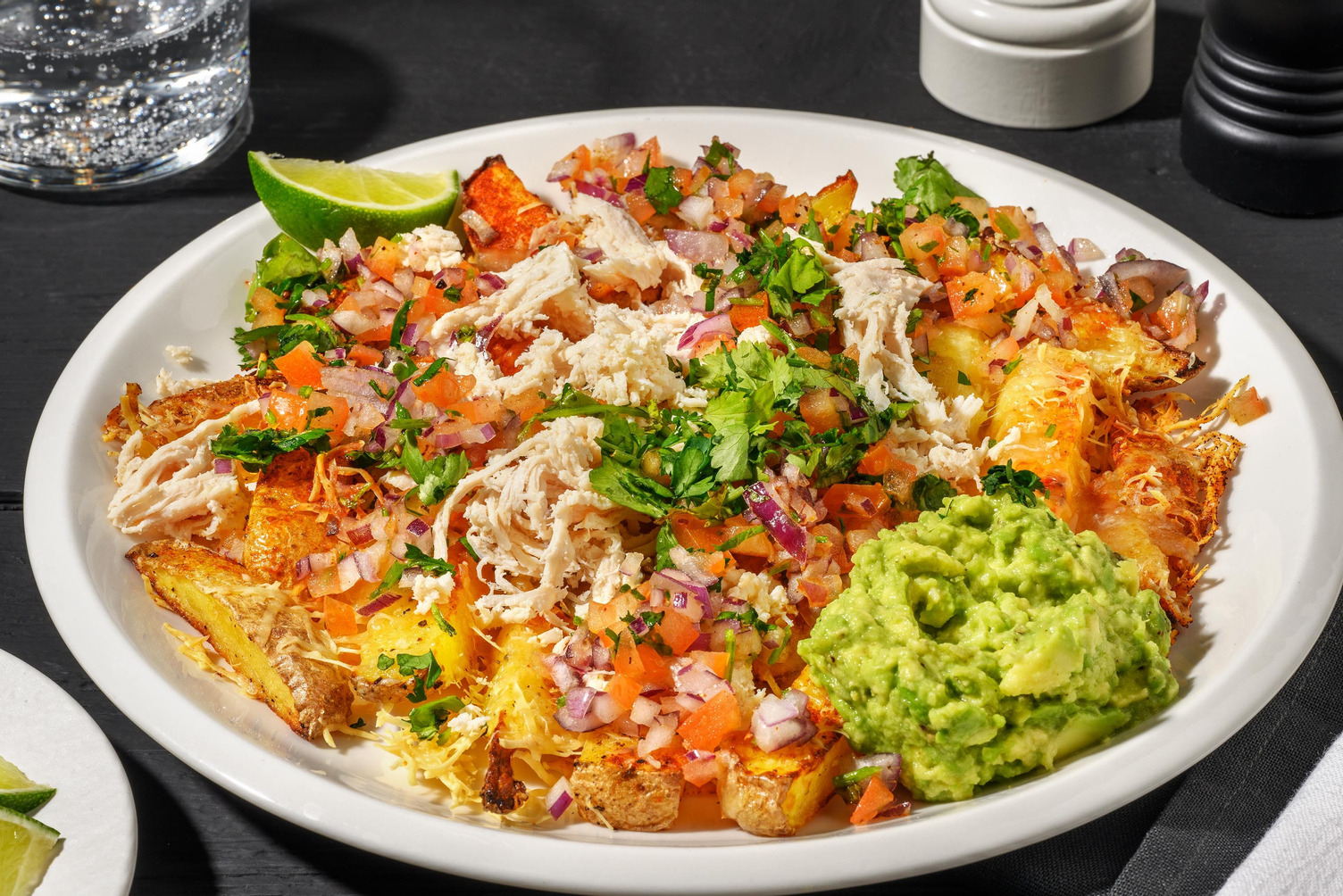 Cheesy loaded fries met pulled chicken