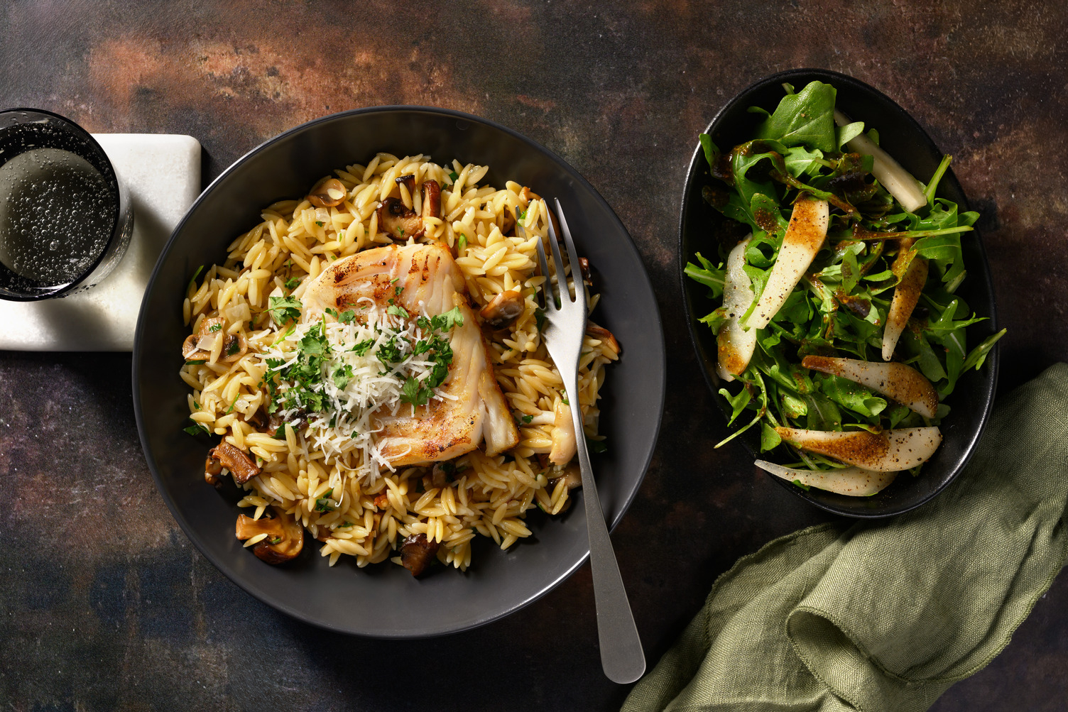 Kabeljauw met orzo, champignons, truffelolie en Parmigiano Reggiano