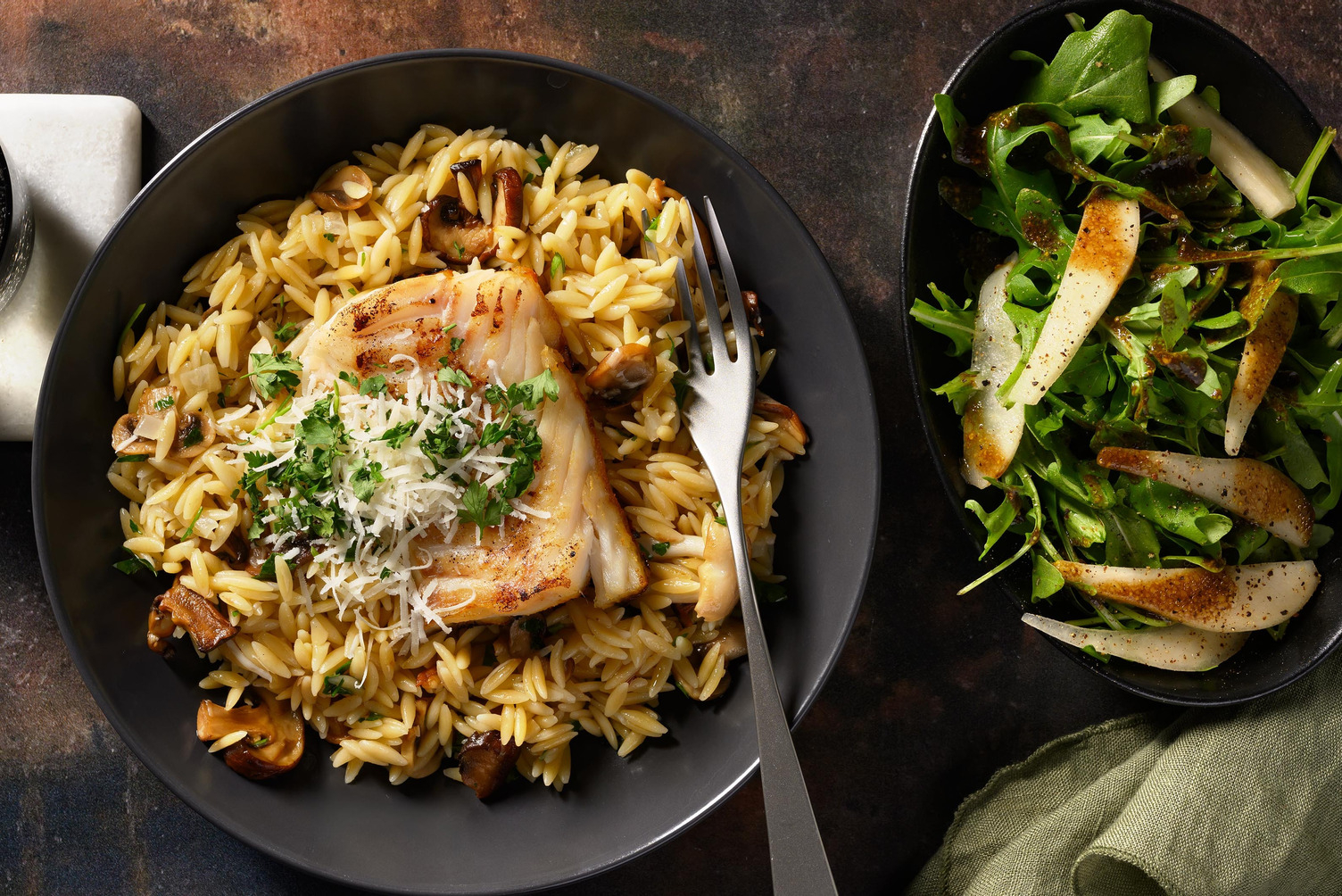 Kabeljauw met orzo, paddenstoelen, truffelolie en Parmigiano Reggiano