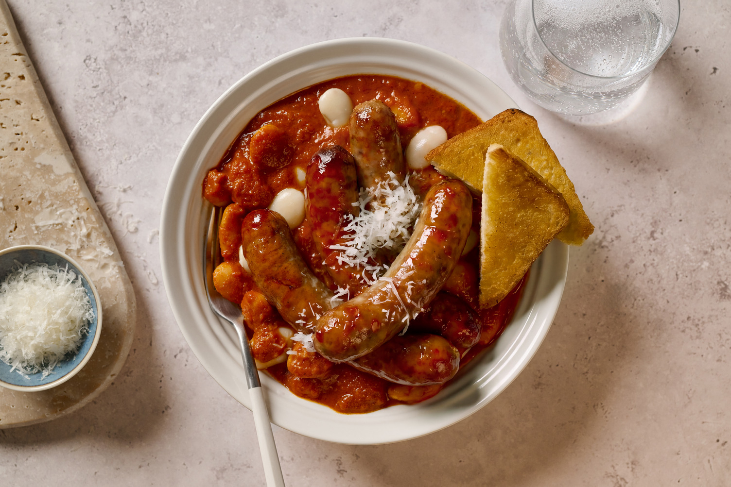 Double Sausages on Cheesy Peri Peri Butter Beans