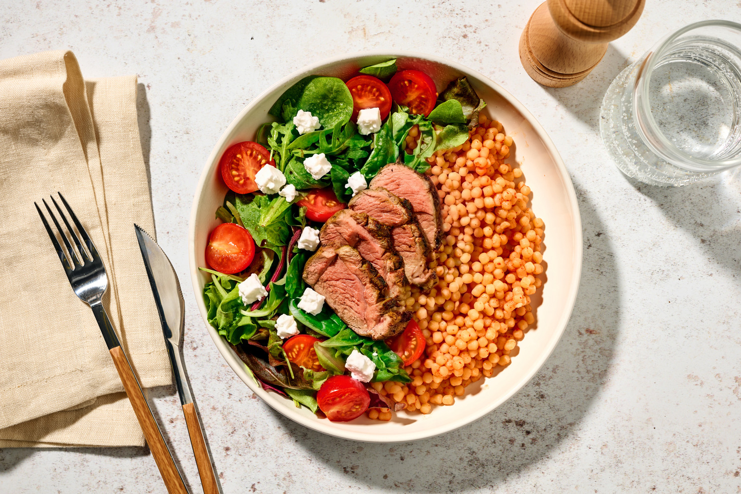 Spiced Plant-Based Crumbed Chick'n & Harissa Pearl Couscous