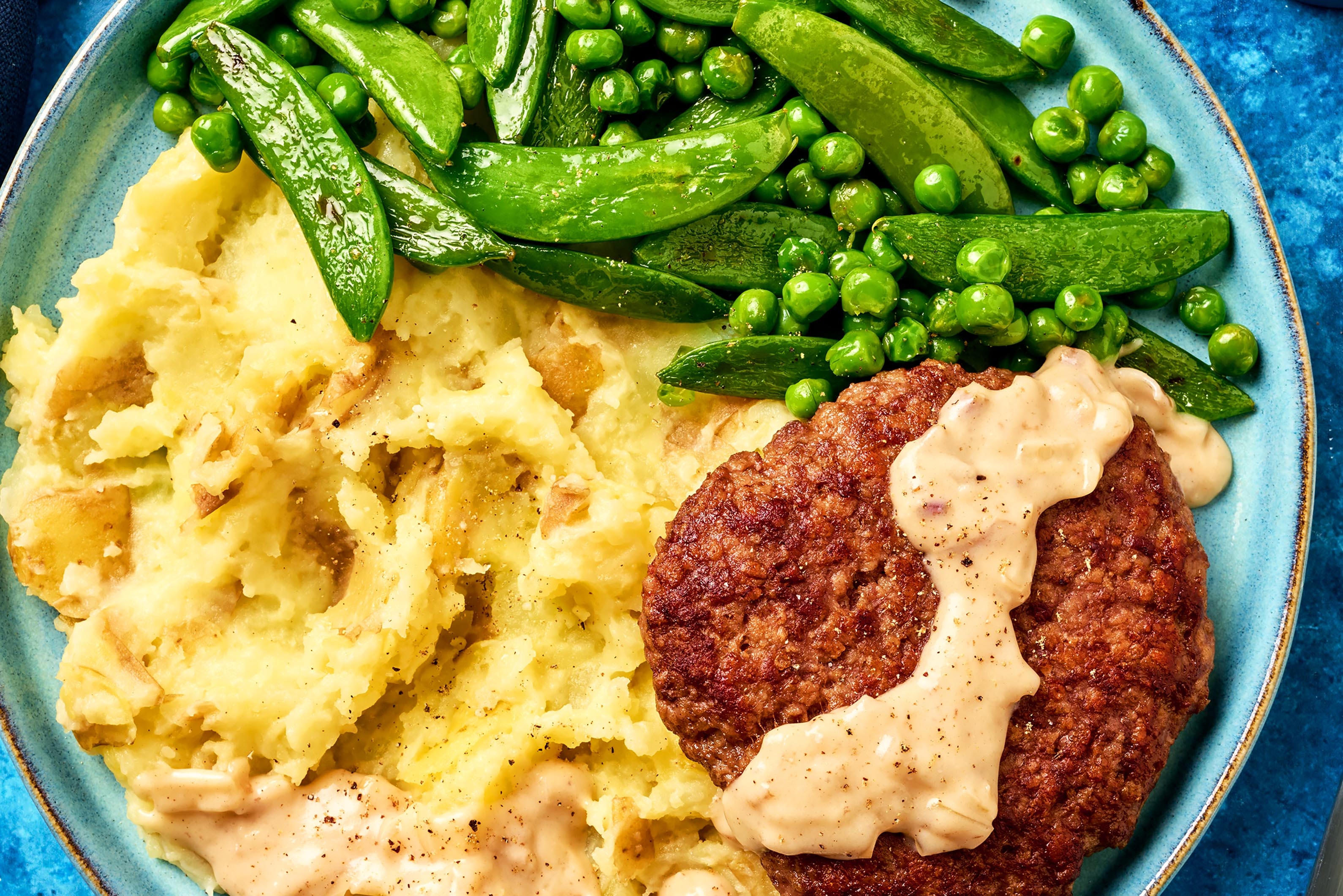 Galettes de bœuf aux épices de Montréal et sauce de cuisson aux échalotes