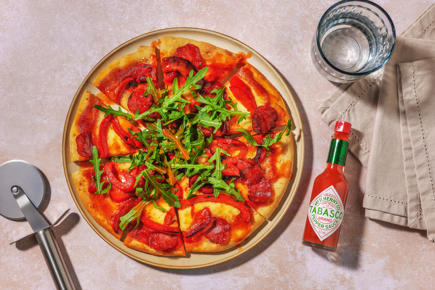 Double Chorizo and Charred Pepper Thin Crust Pizza and TABASCO® Sauce Drizzle