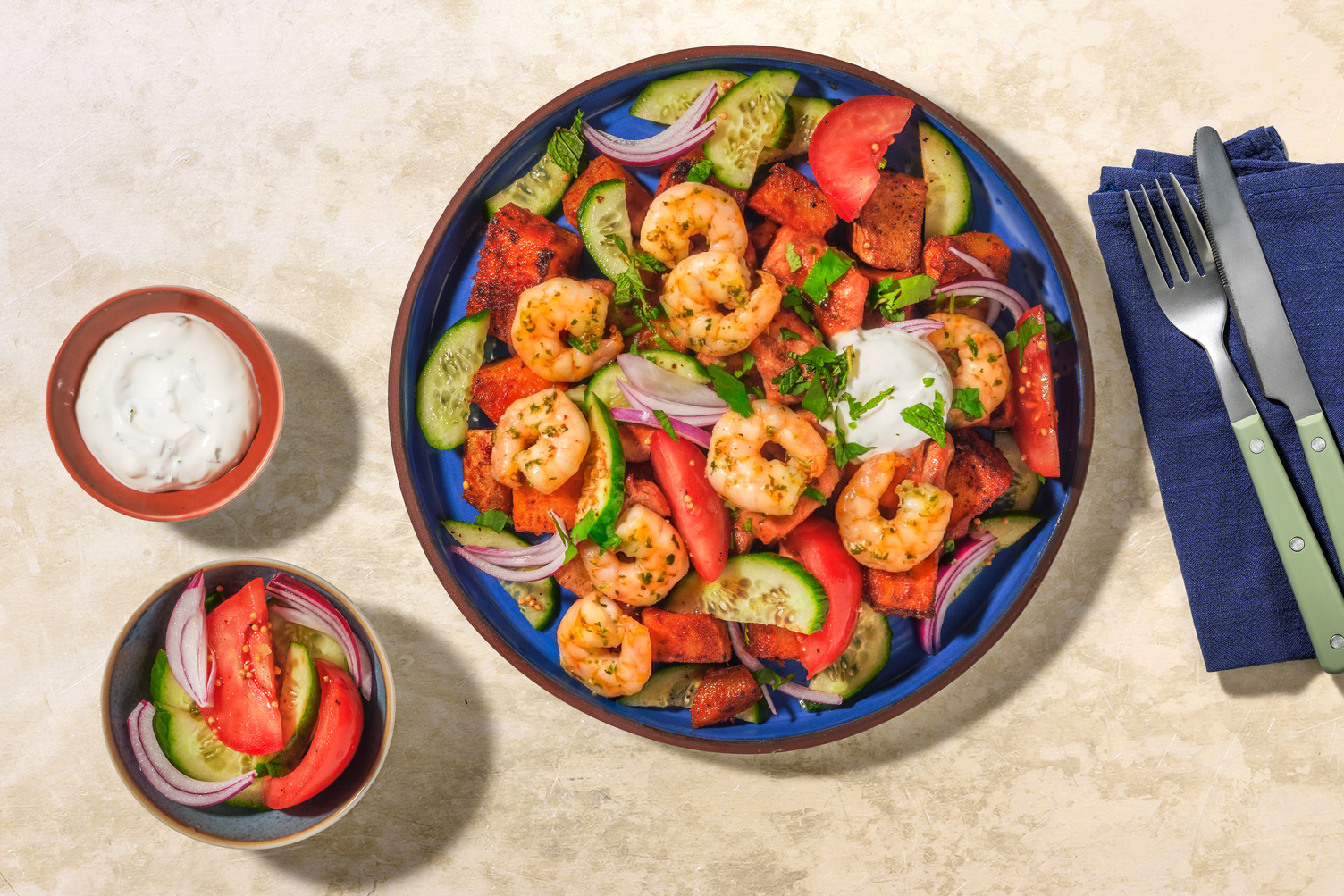 Scampi's met tandoori-patatjes en yoghurtsaus