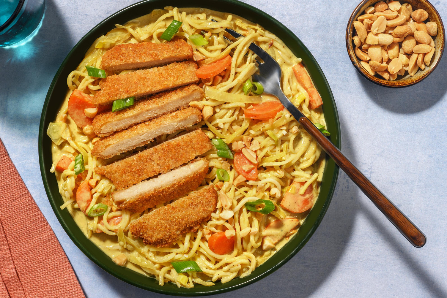 Veggie schnitzel met gele currynoedels