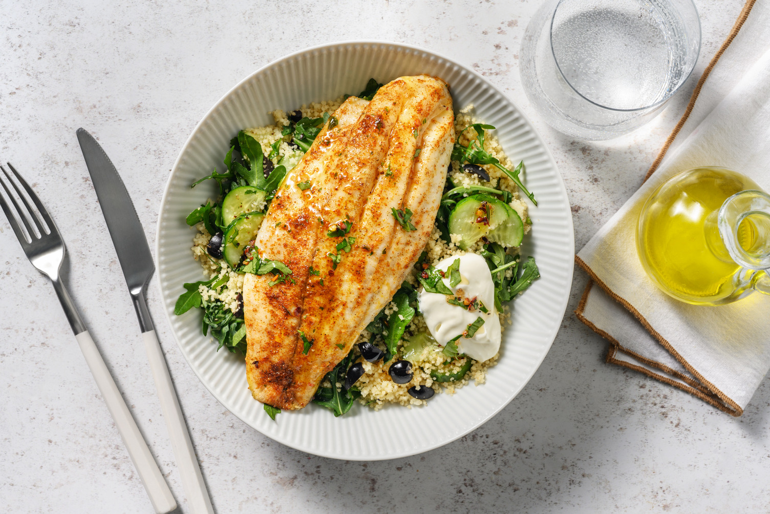Baked Spiced Basa and Herby Olive Couscous