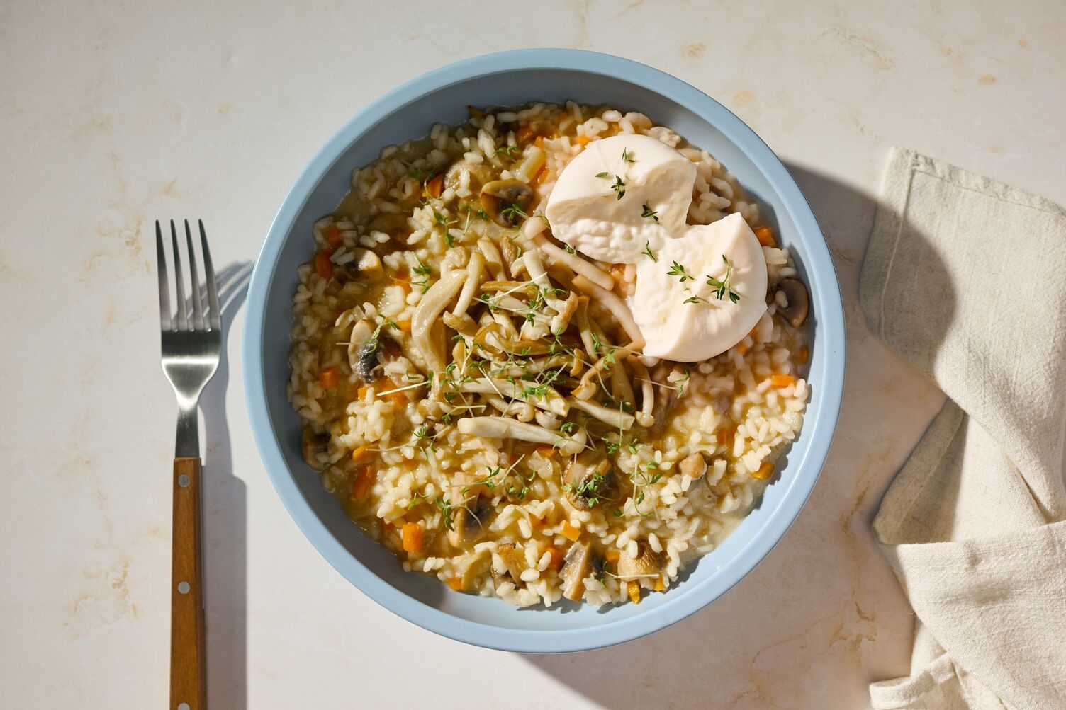 Risotto mit Shimeji Pilzen, Burrata & Guanciale