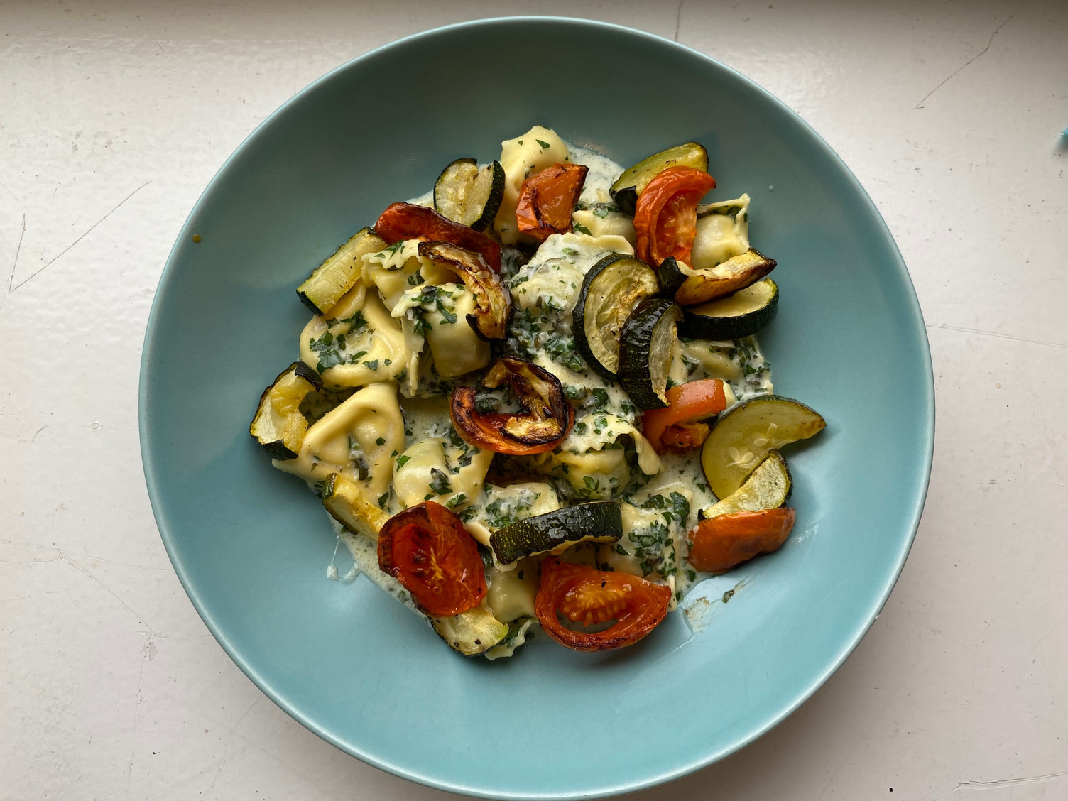 Tortelloni in a creamy herb sauce