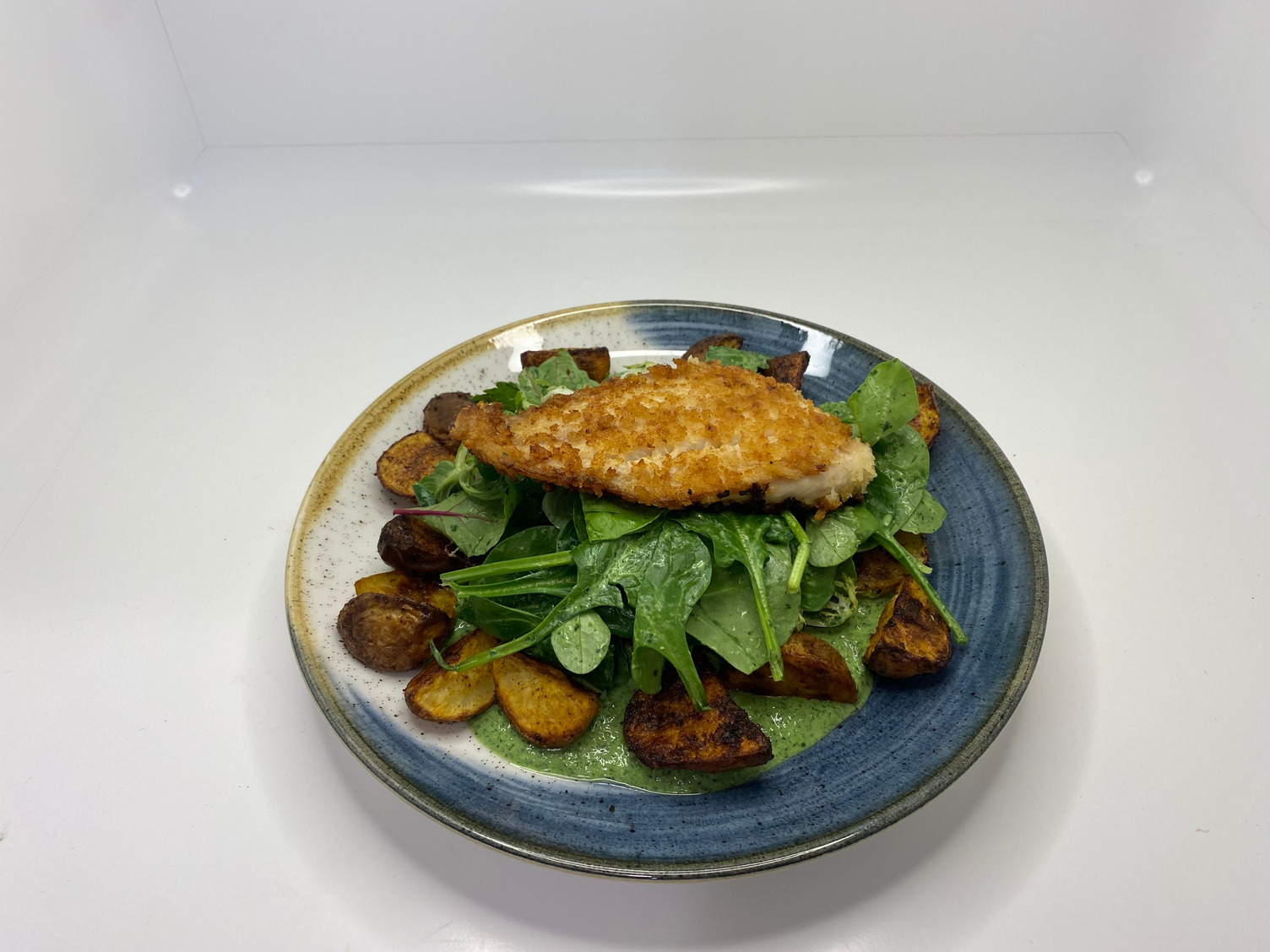 Springtime Breaded pangasius with green sauce & potatoes