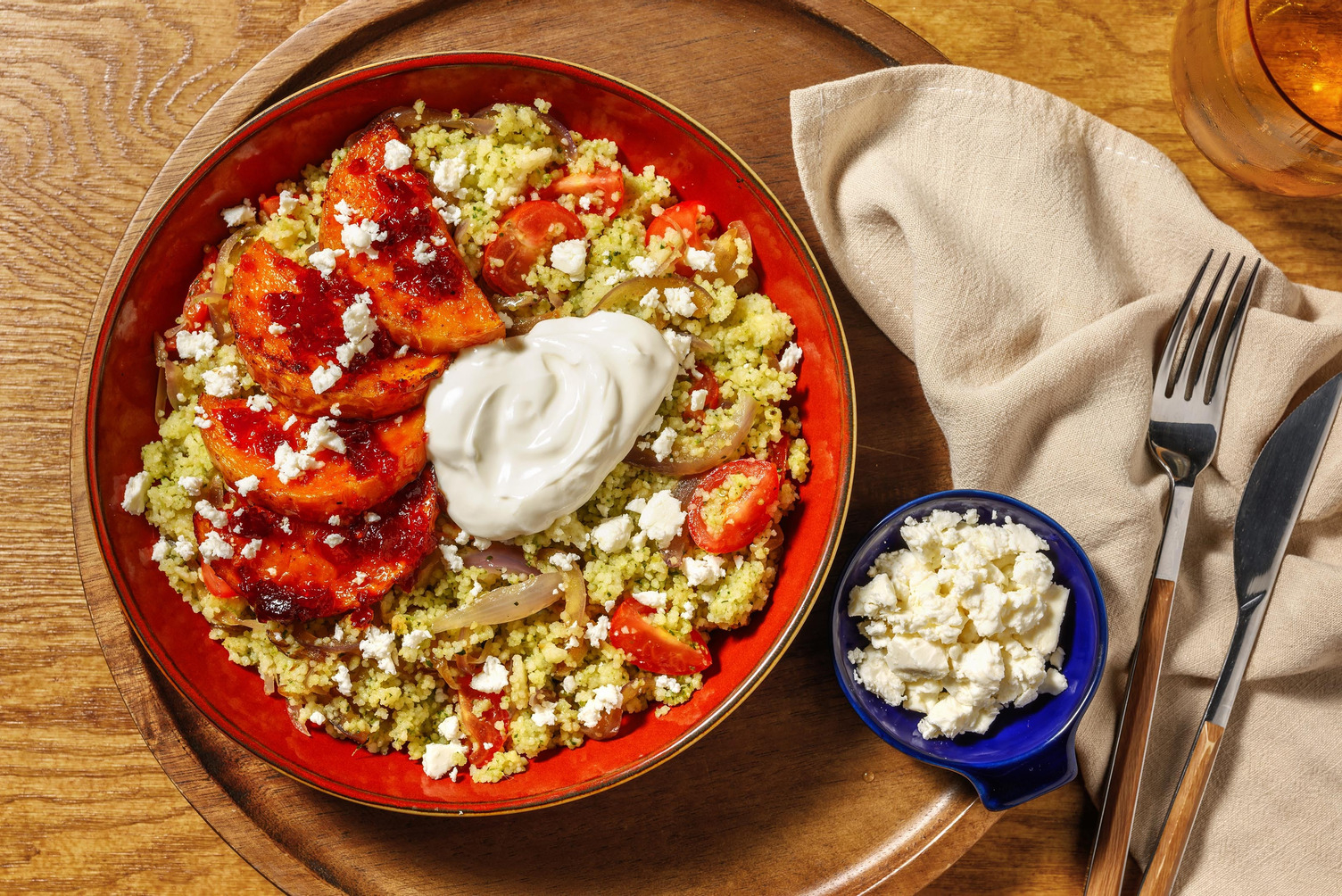 Salmon and Peri Peri Squash on Tomato Zhoug Couscous
