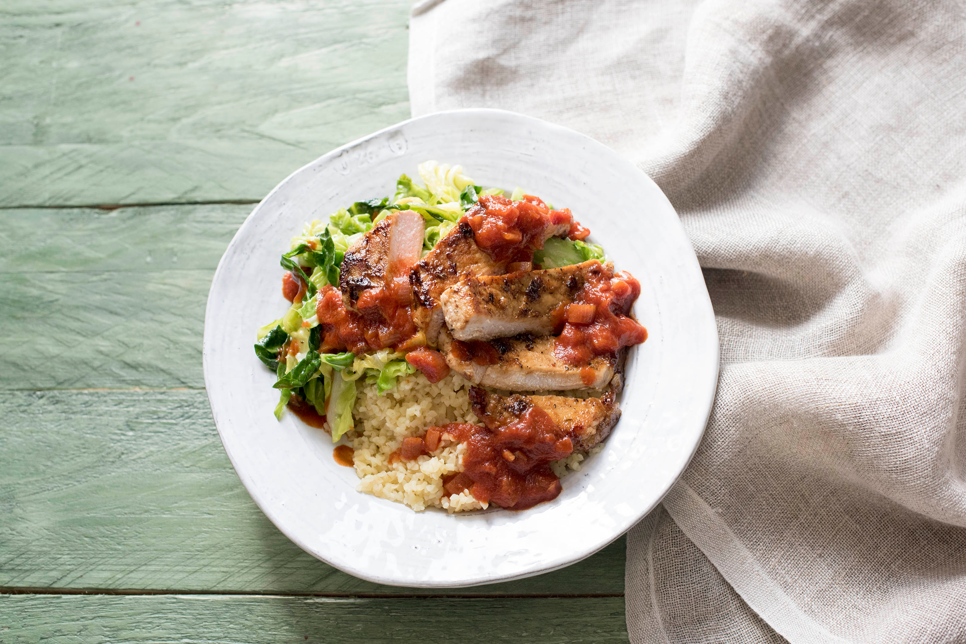 Cajun Pork with Bulgur Wheat and Garlicky Spring Greens
