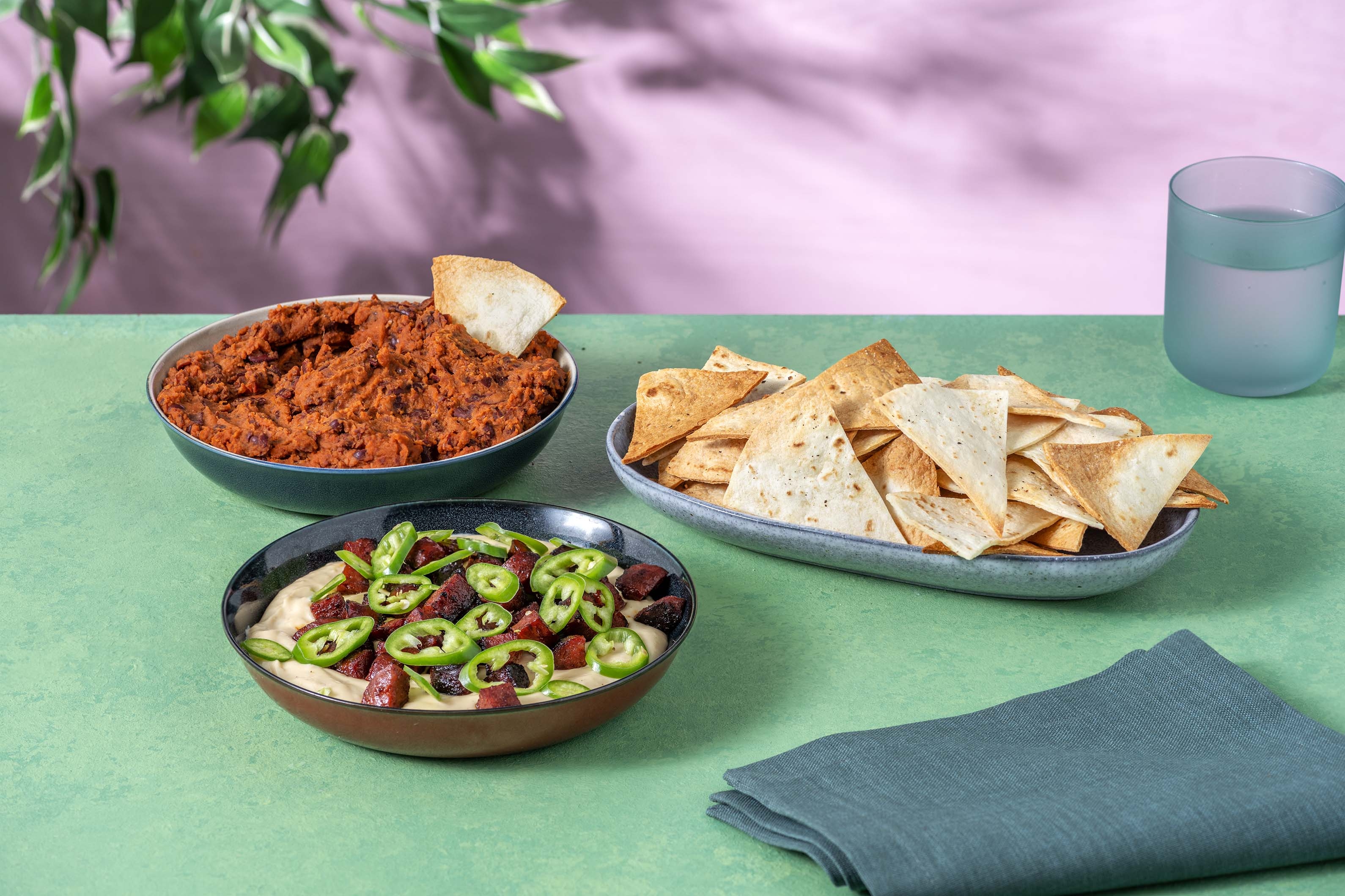 Crispy Nachos with Cheesy Chorizo Queso and Refried Bean Dip