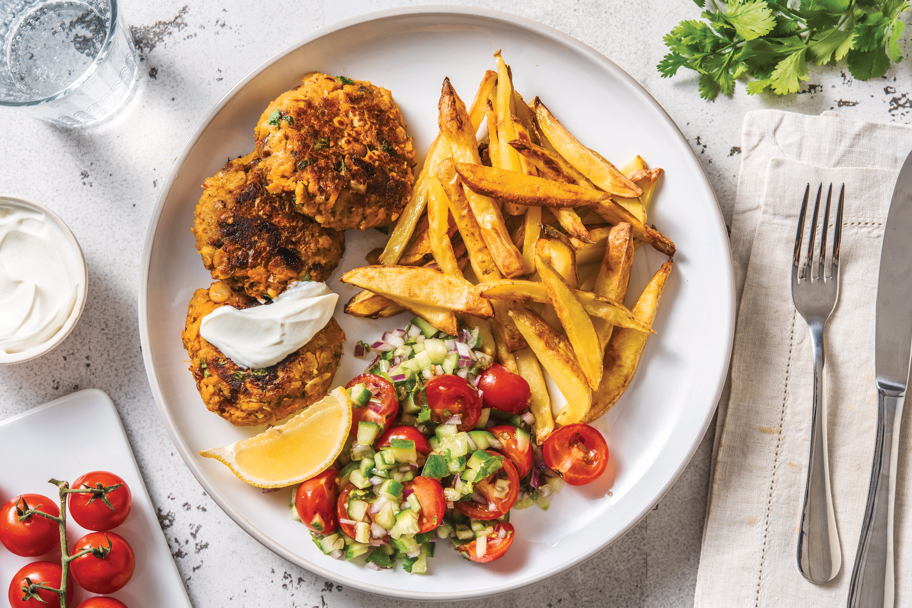 Curried Chickpea Patties & Fries with Cherry Tomato-Cucumber Salad & Lemon Yoghurt