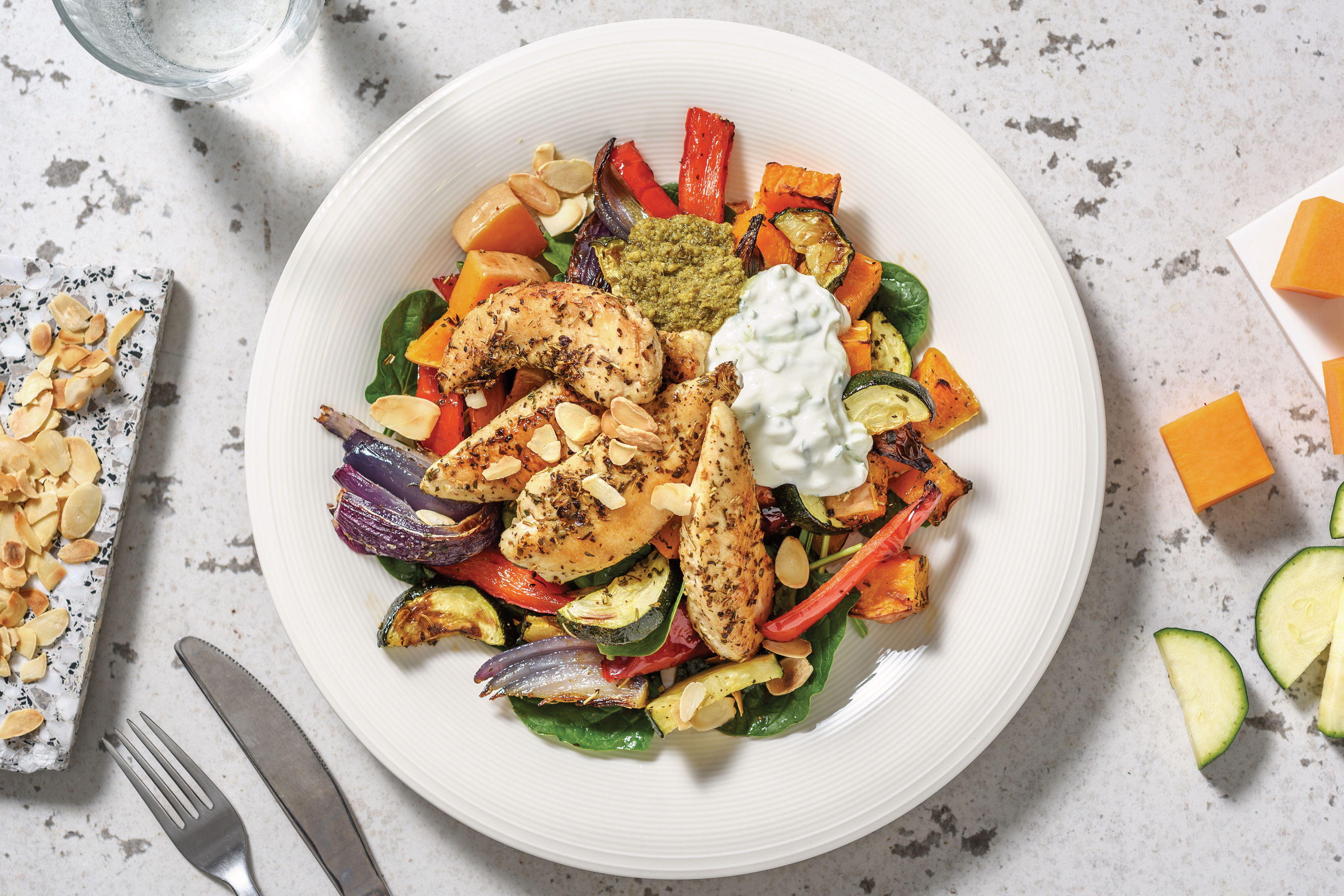 Herby Chicken Tenders & Roast Veggie Toss with Pesto & Tzatziki