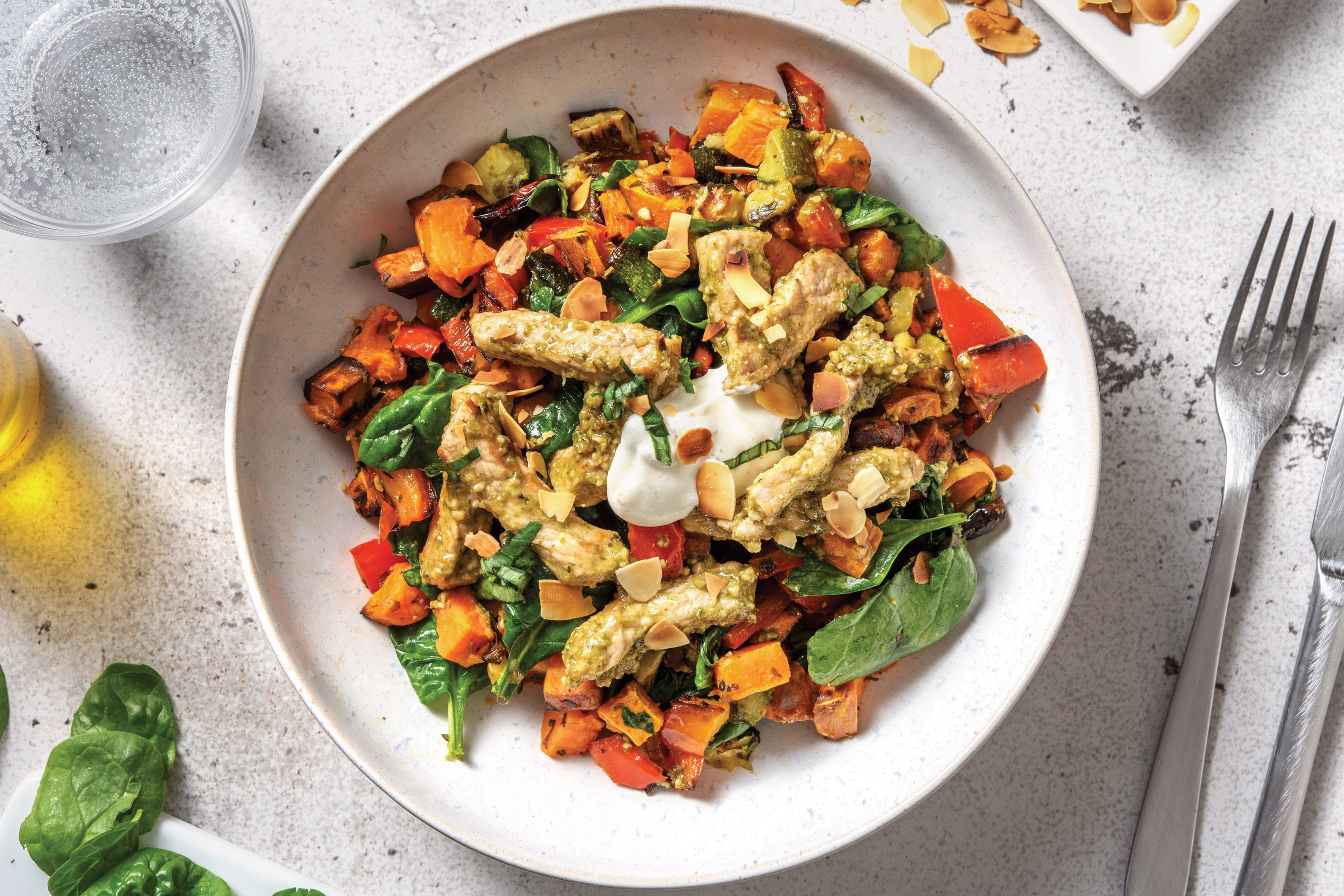 Pesto Pork & Roast Veggie Toss with Garlic Yoghurt & Flaked Almonds