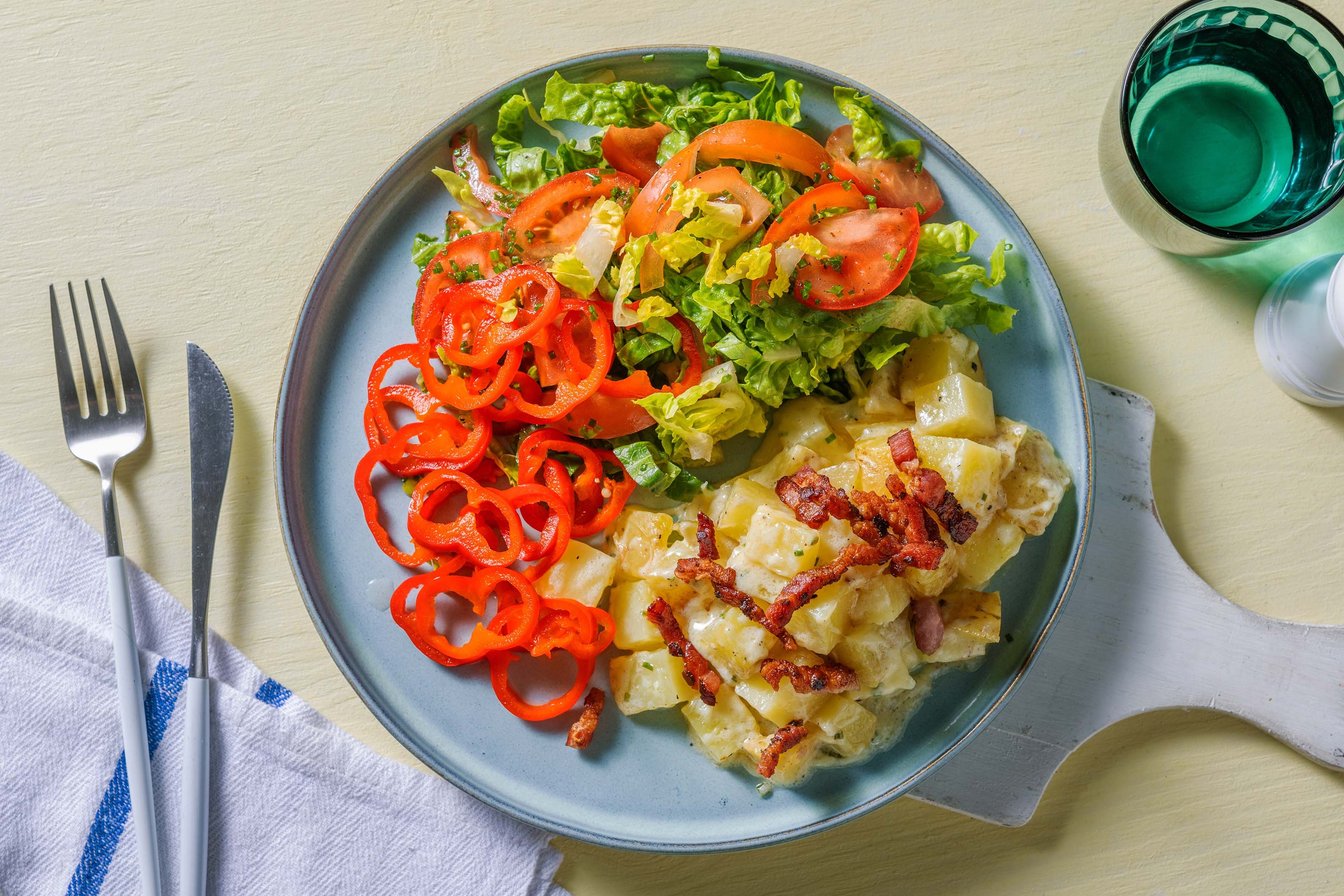 Pommes de terre aux lardons, crème fraîche et cheddar