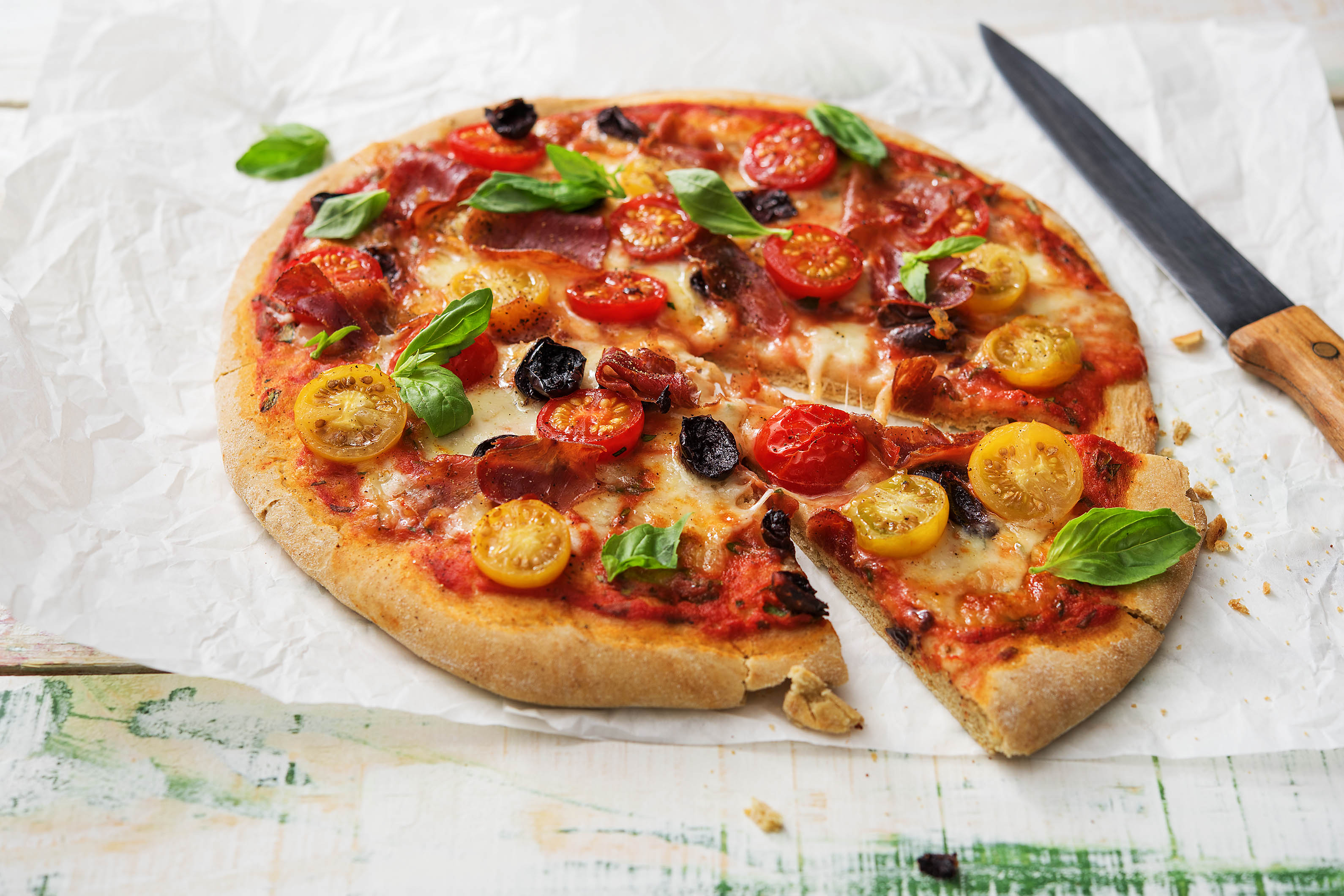 Black Olive, Serrano Ham and Red and Yellow Cherry Tomato Pizza
