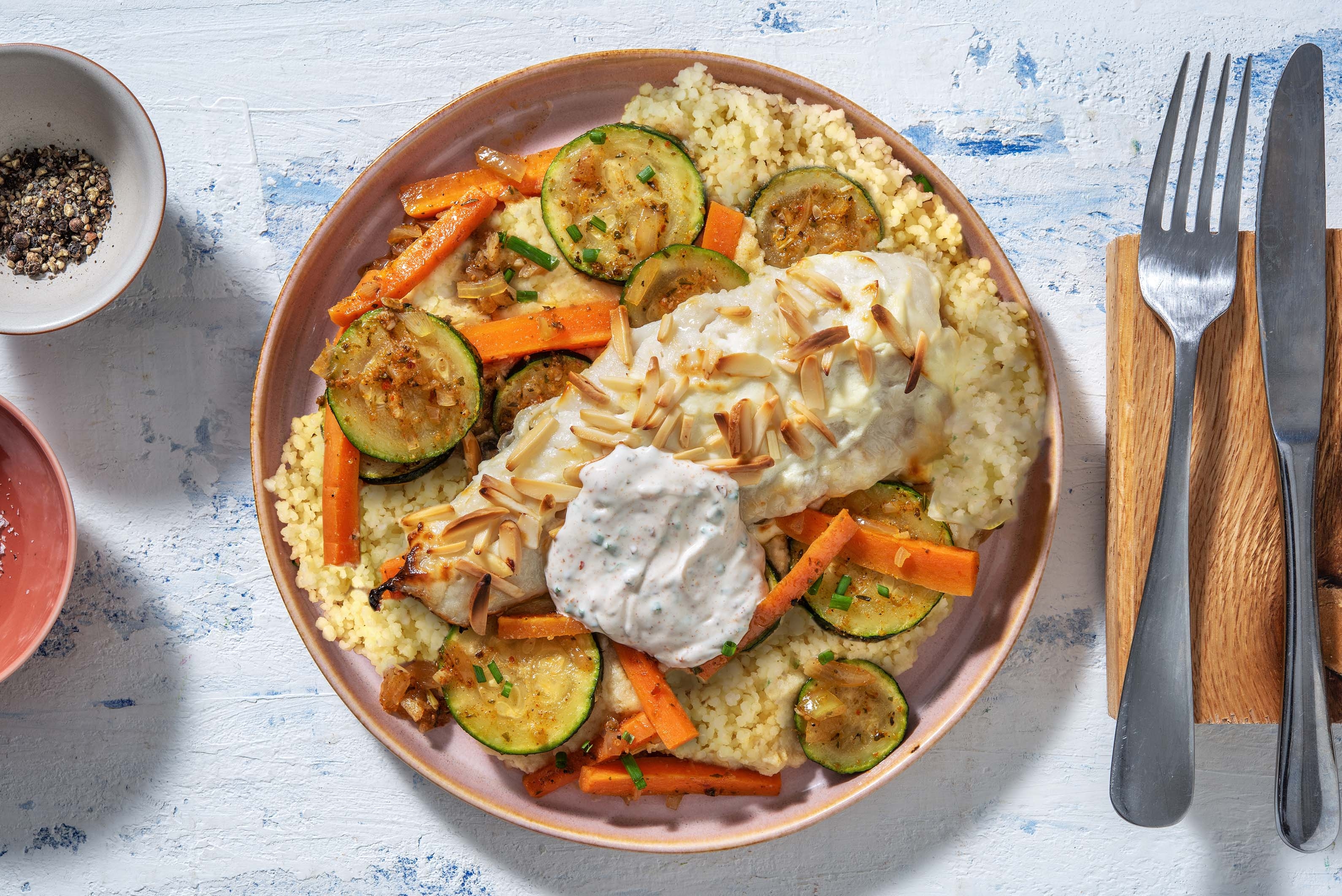 Cabillaud en croûte d'amandes et semoule aux légumes