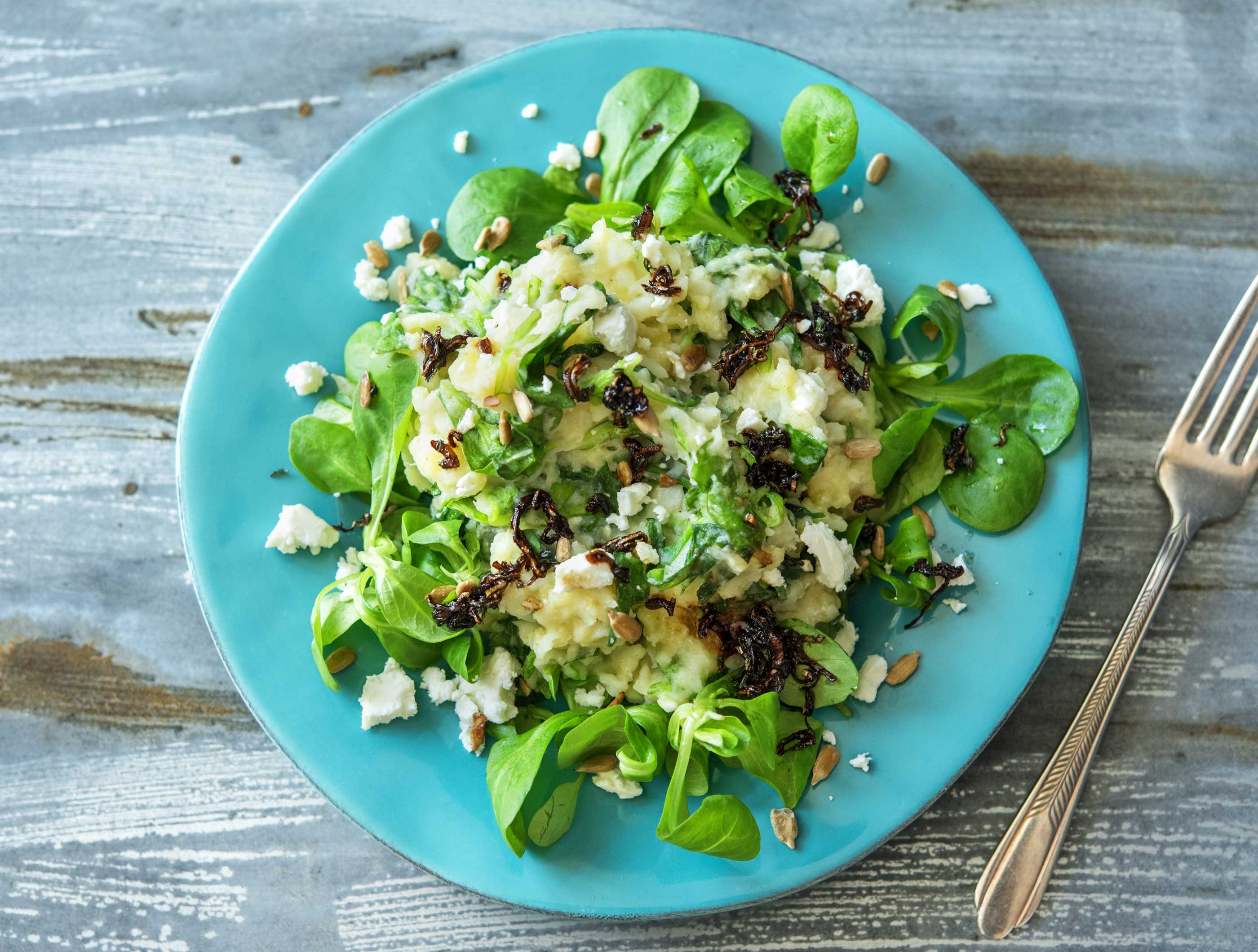 Knolselderijstamppot met feta en zonnebloempitten