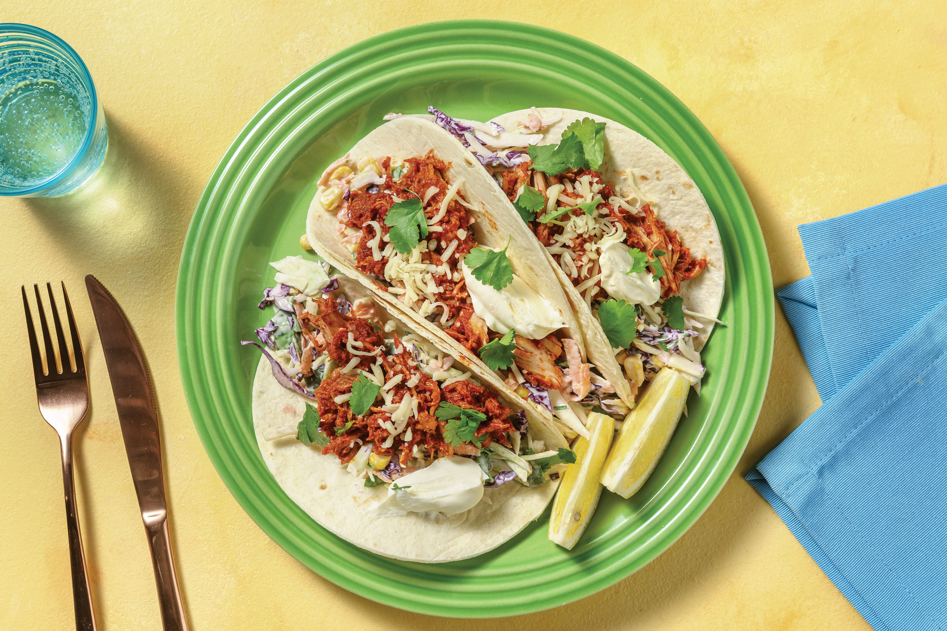Peri Peri Pulled Chicken Tacos with Sour Cream, Cheddar & Corn Slaw