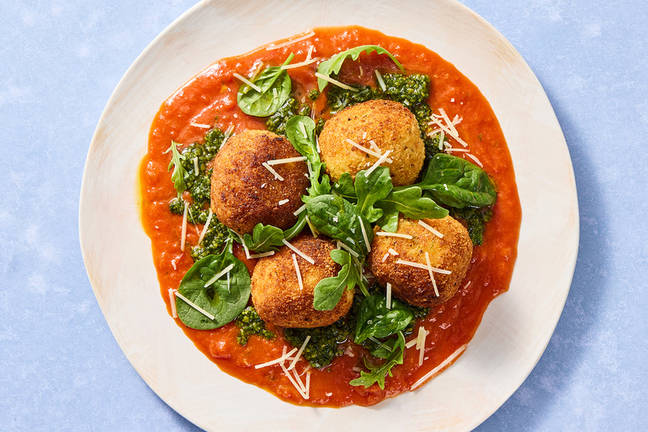 Bocconcini-Stuffed Arancini with Pesto and Peppery Greens