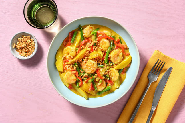 Gele curry met garnalen en pinda's