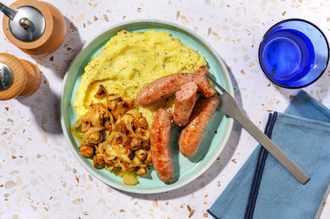 Salchichas de cerdo acompañadas de puré al tomillo 