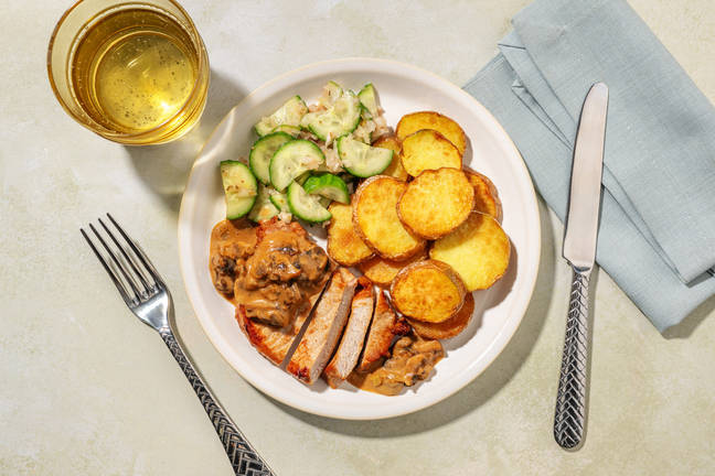 Varkensoester in romige kalf-champignonsaus