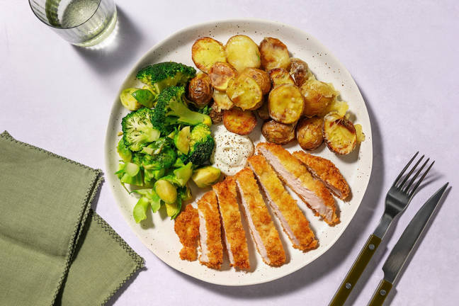 Fläskschnitzel och krispig osttoppad potatis