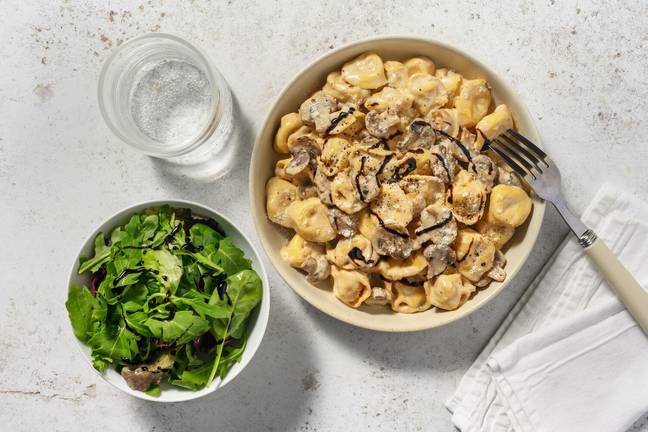 Cured Ham Tortelloni in Creamy Mushroom Sauce