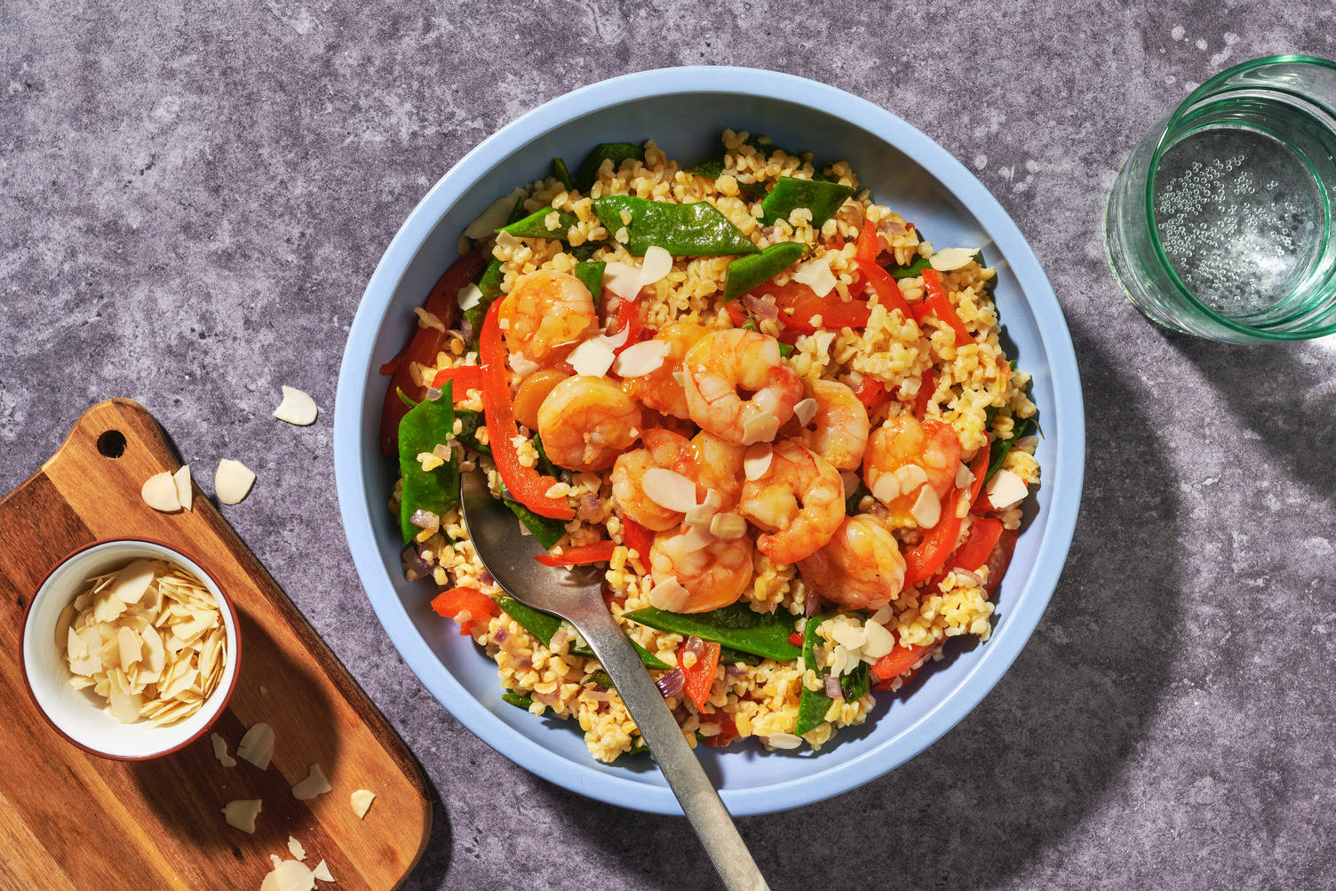 Scampi's in appelsiensaus met amandelschaafsel