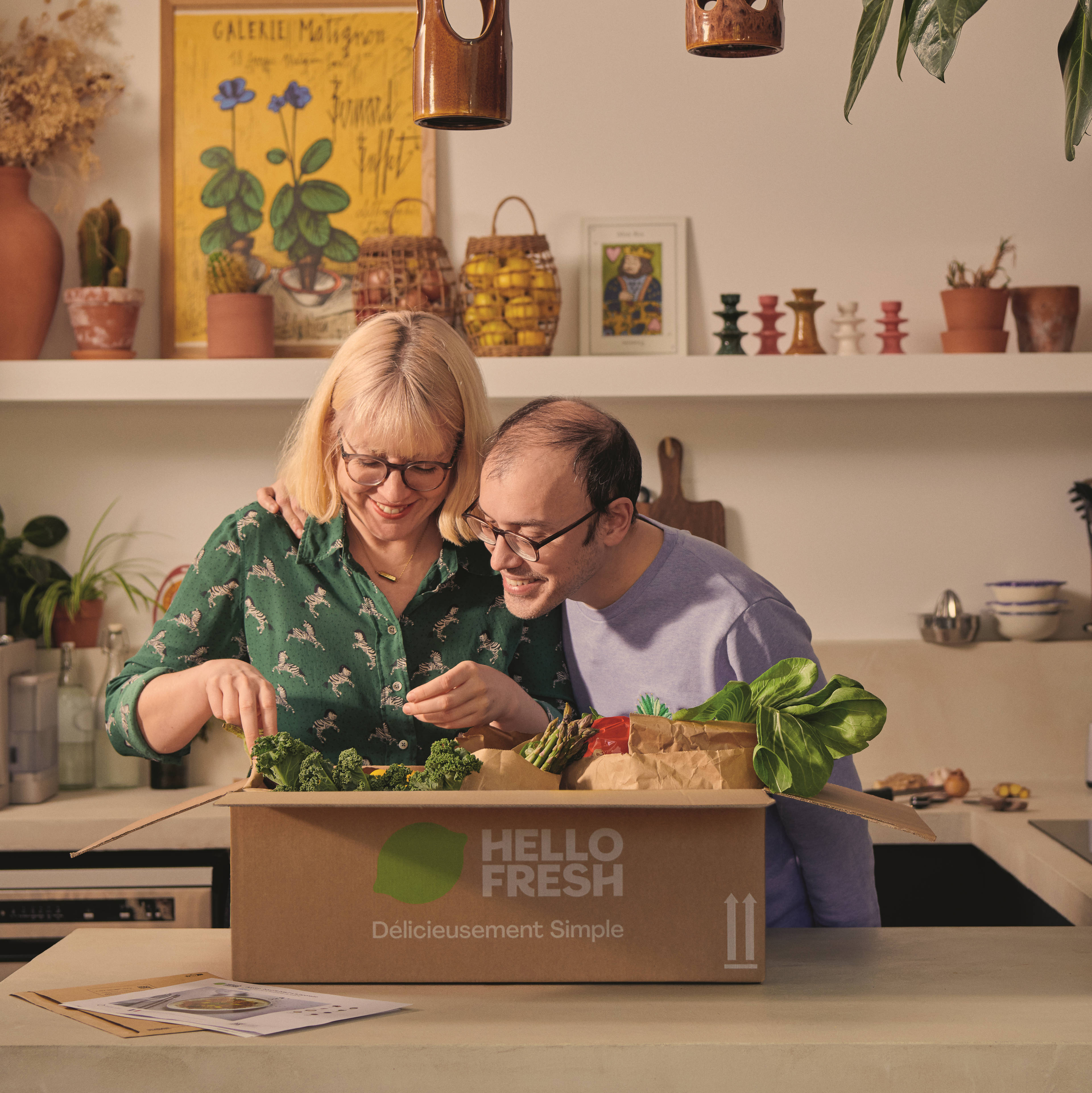 Image of two people cooking