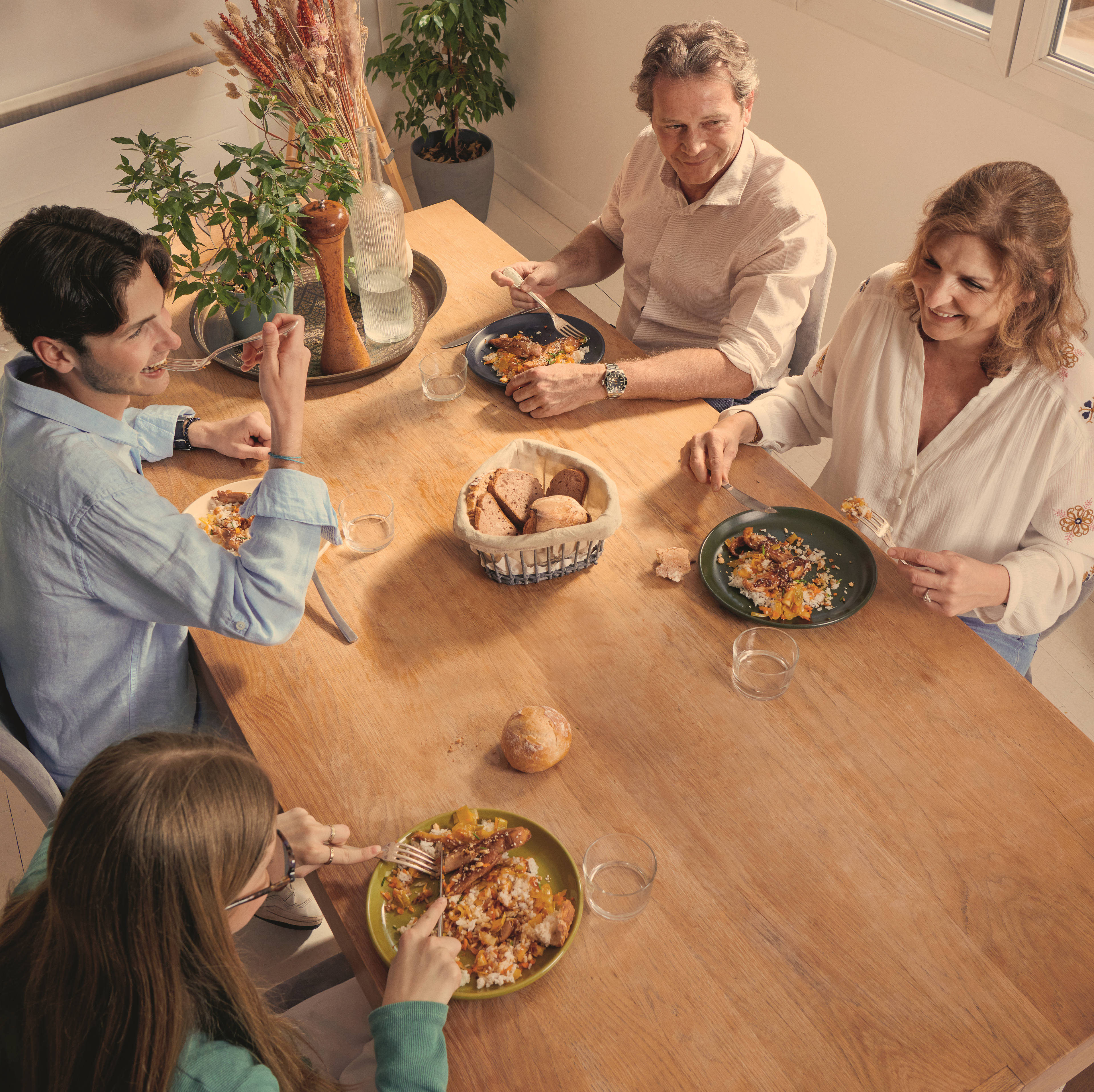 Image of family cooking and enjoying dinner