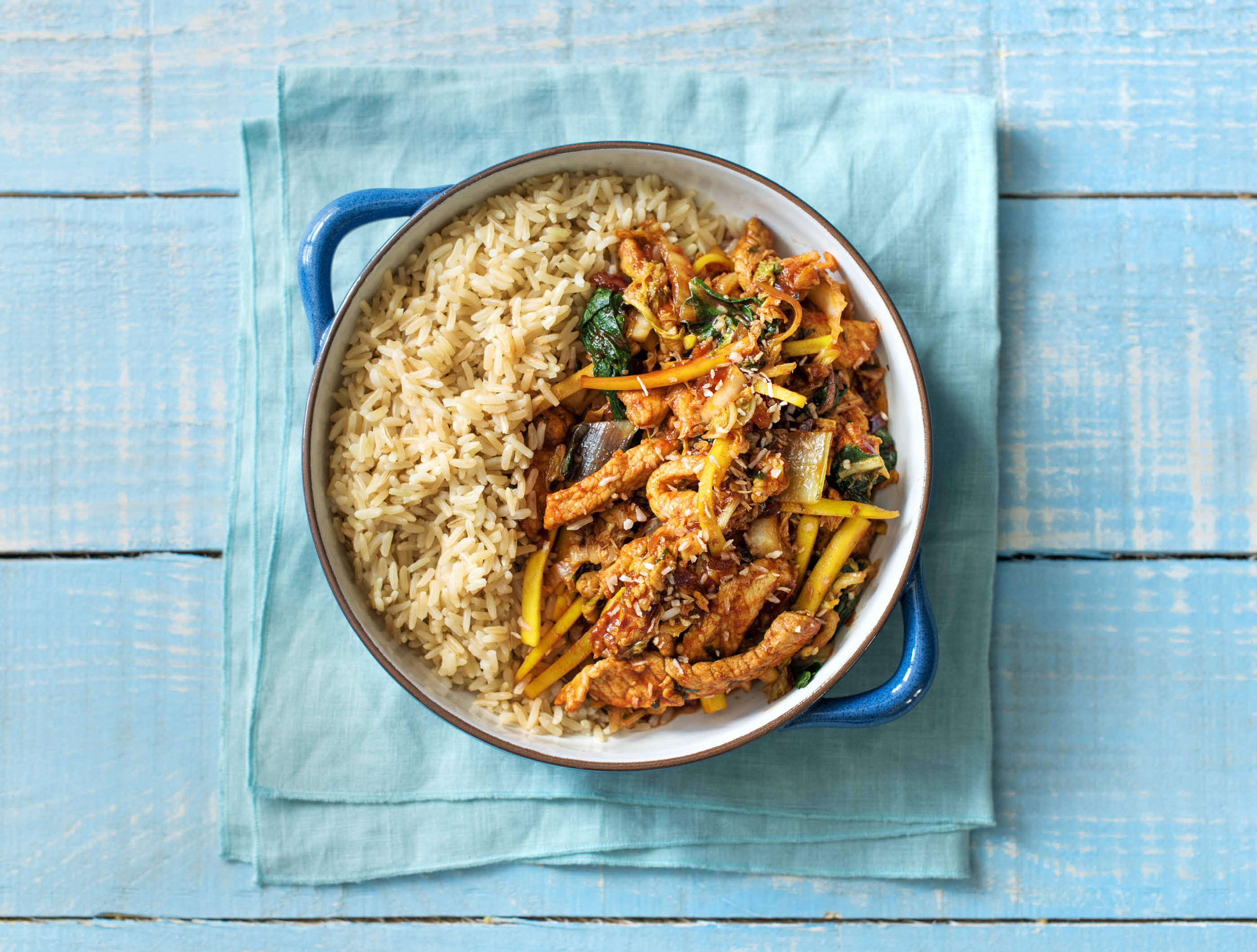 Émincé de filet de porc à l’indienne aux légumes asiatiques et à la noix de coco