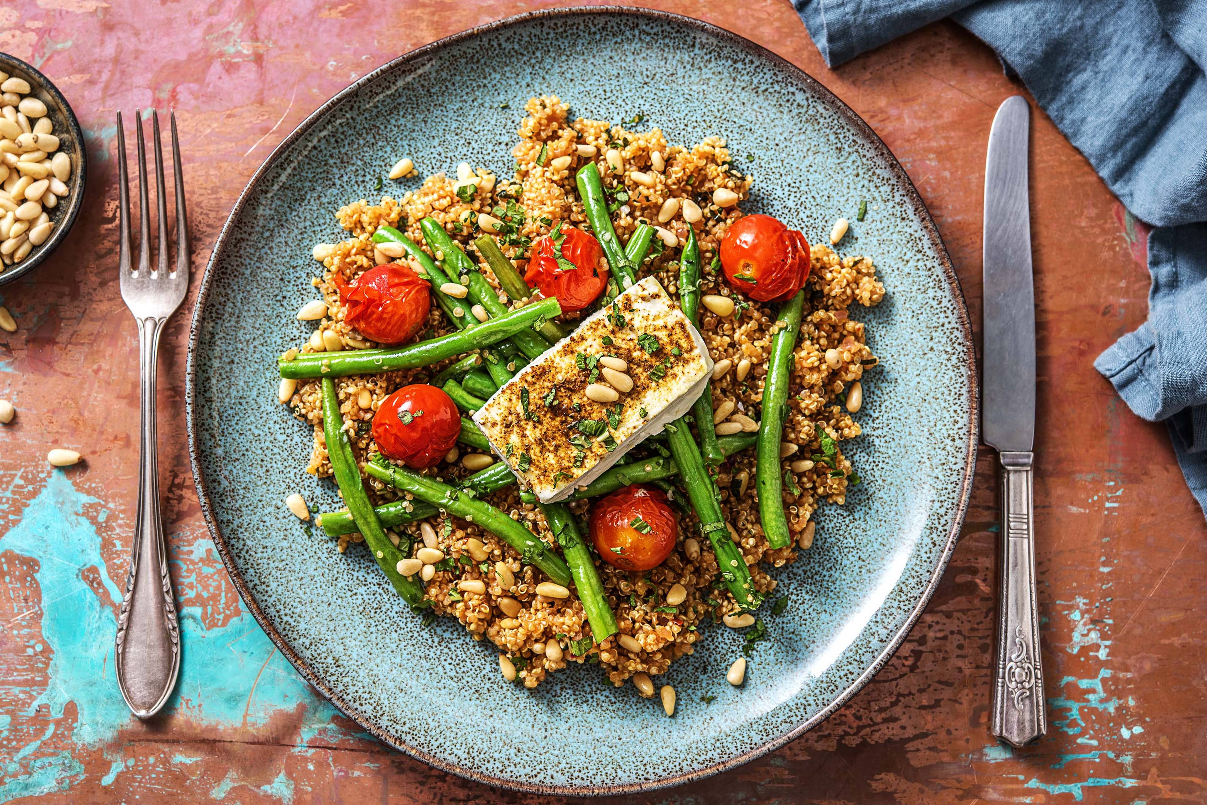 Ras el hanout-quinoa met feta uit de oven