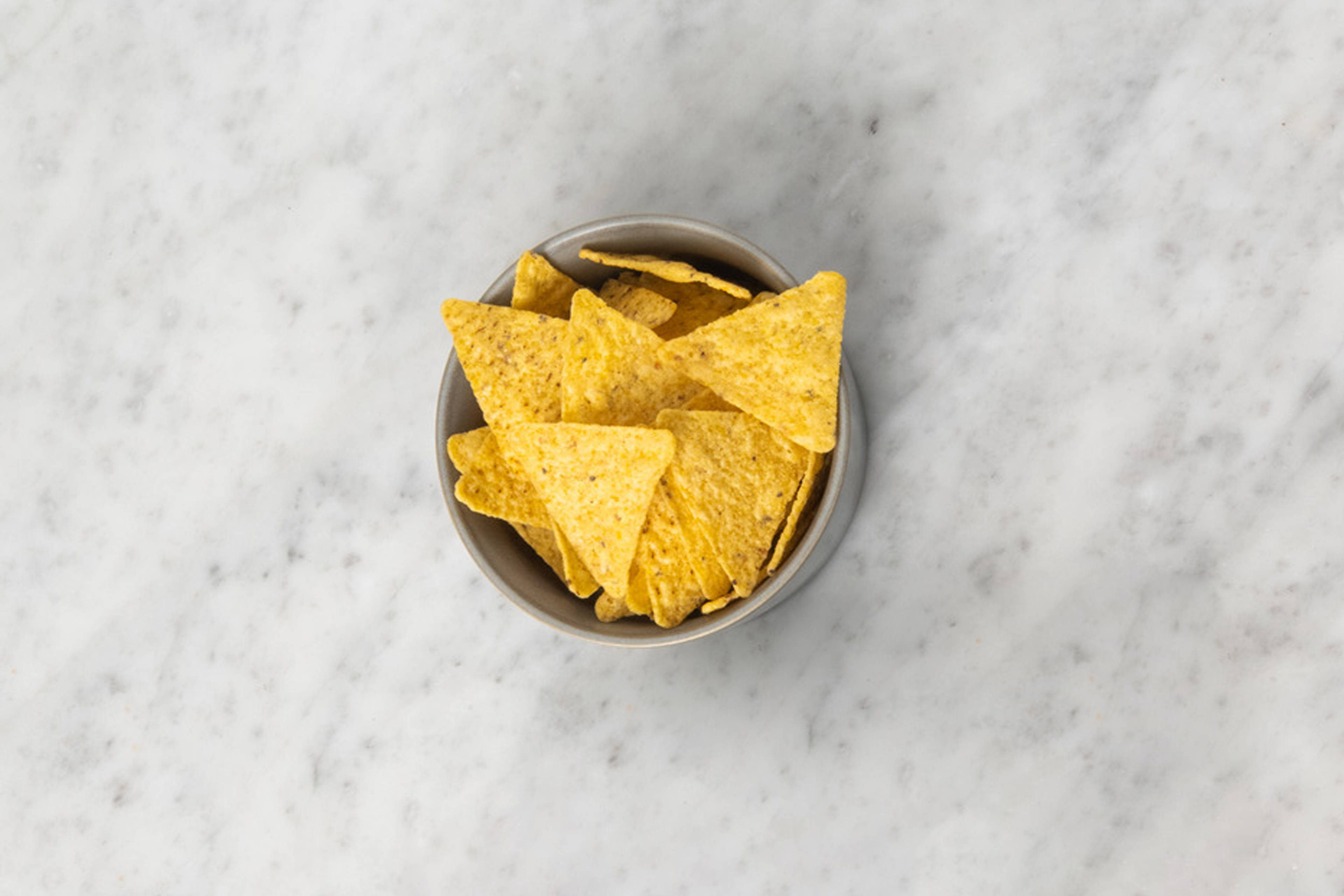 Pittige tortillachips als extra