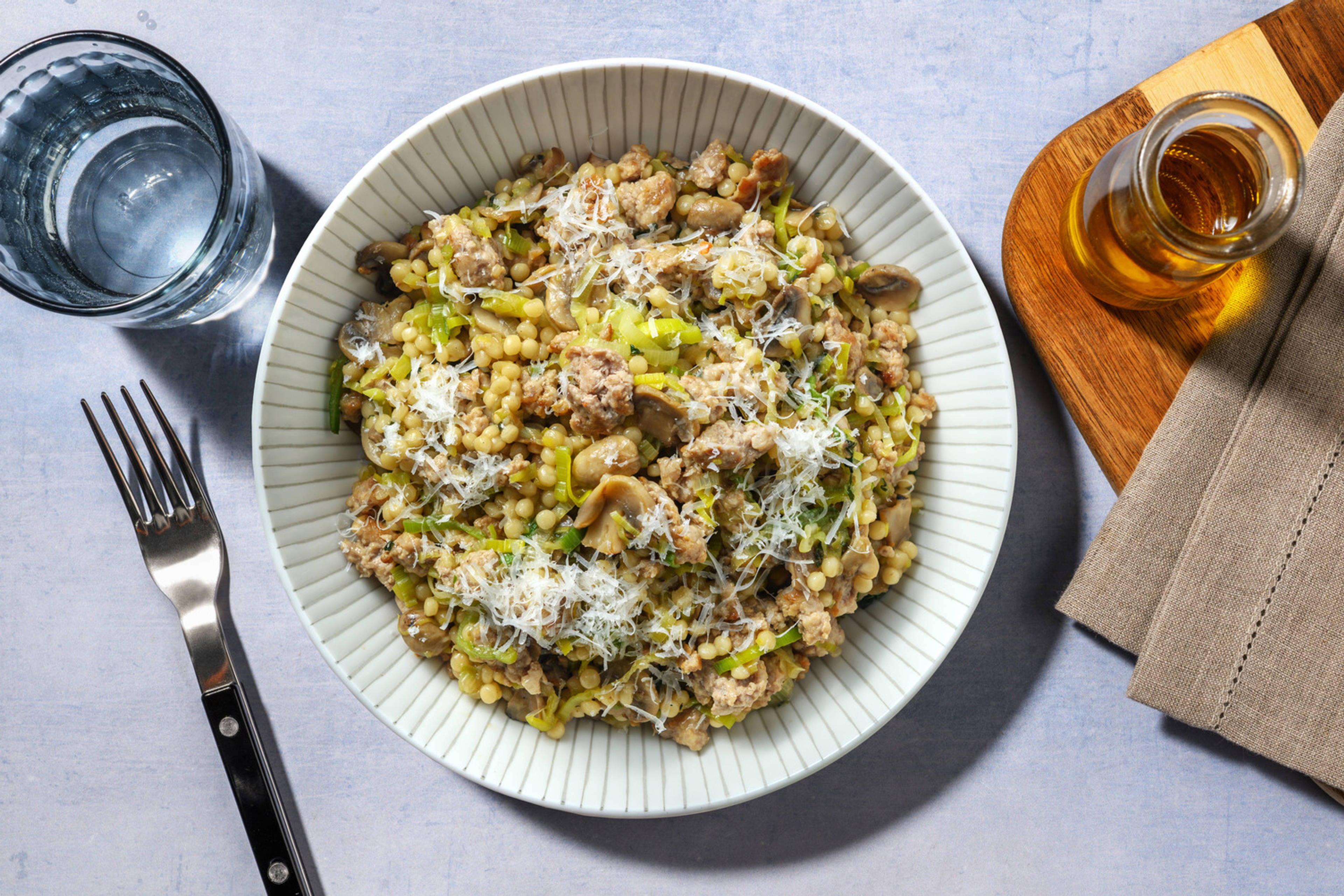 Couscous perlato alla salsiccia e funghi