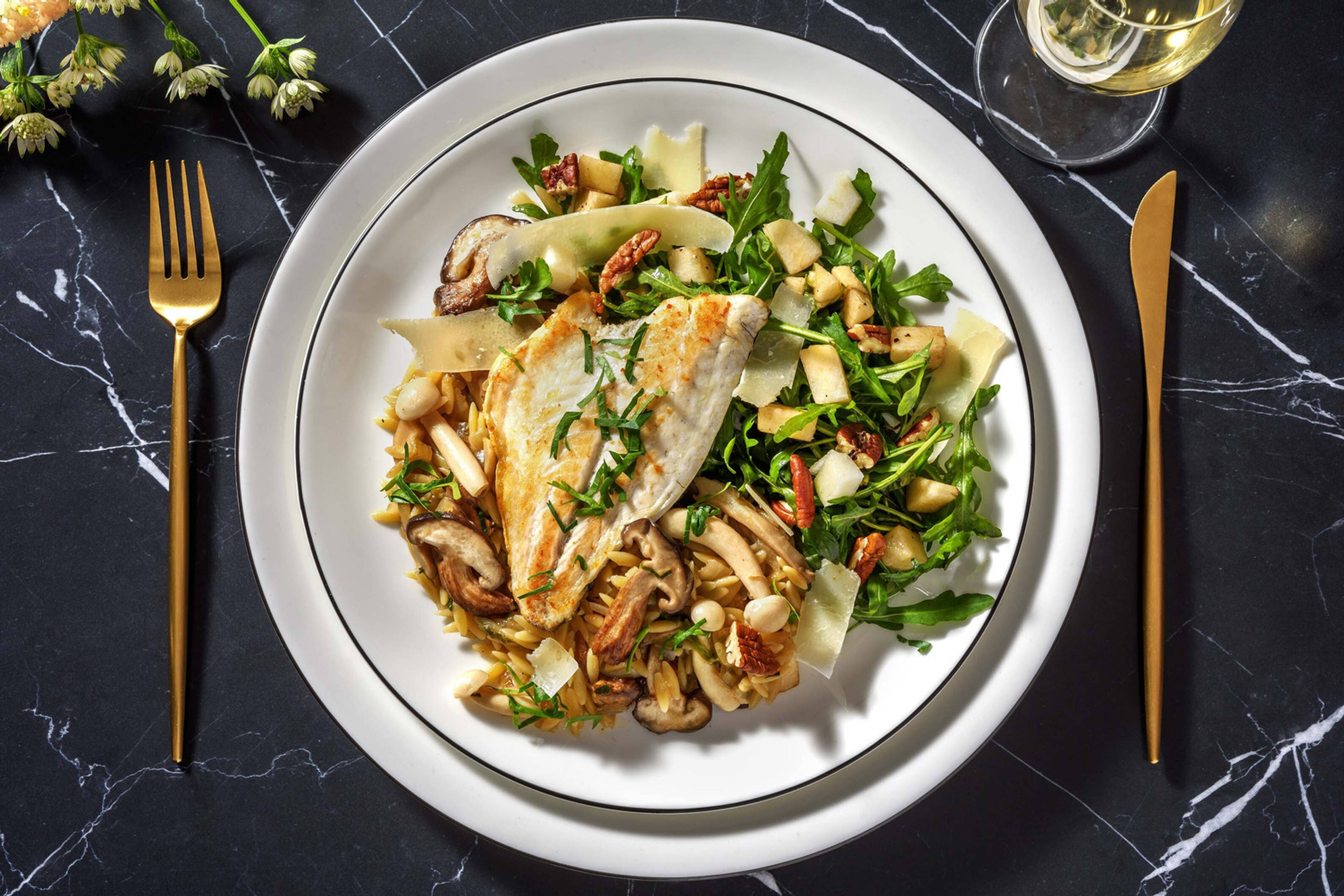 Truffelorzo met doradefilet en paddenstoelen