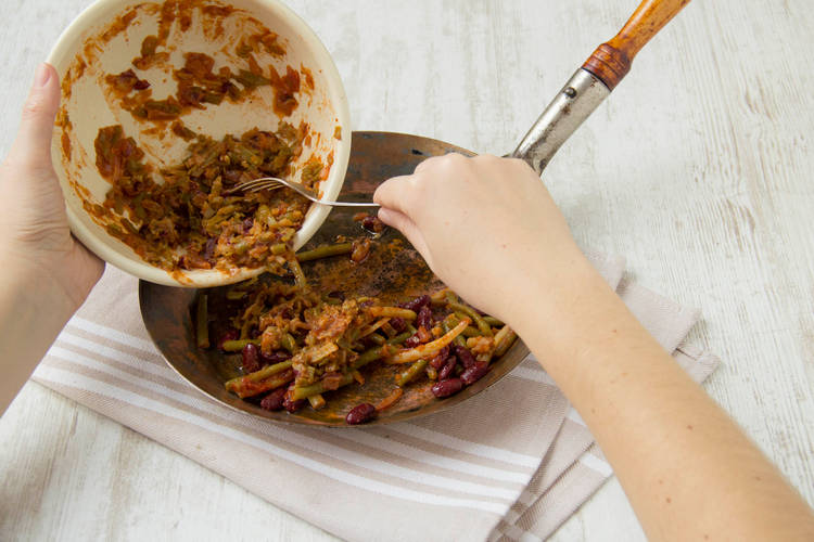 Mix the remaining whole beans into the paste