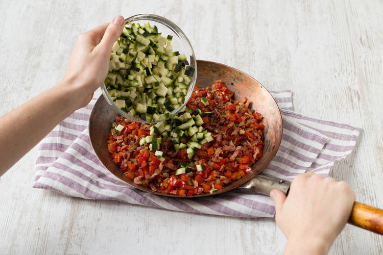Add courgette to vegetables in pan