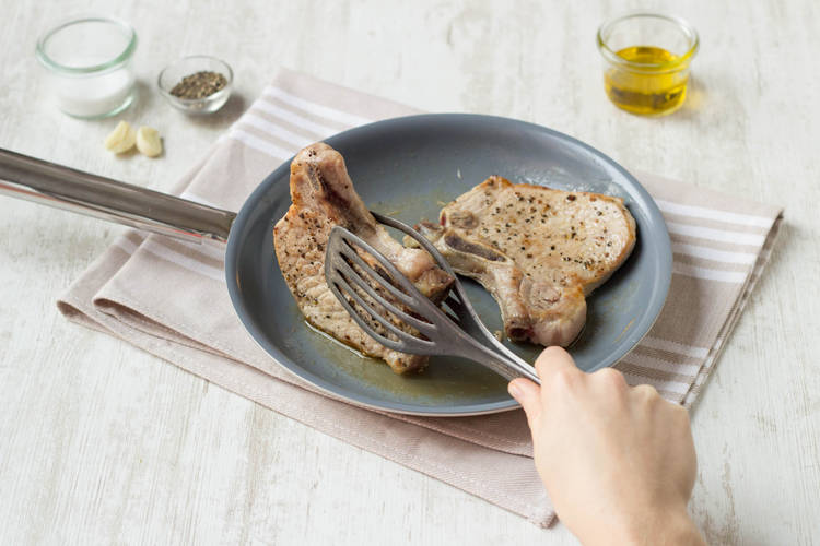 Cook pork chops after rubbing them in with garlic