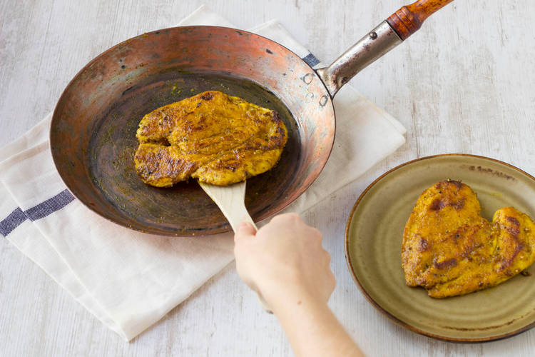 Cook the chicken until it browns off