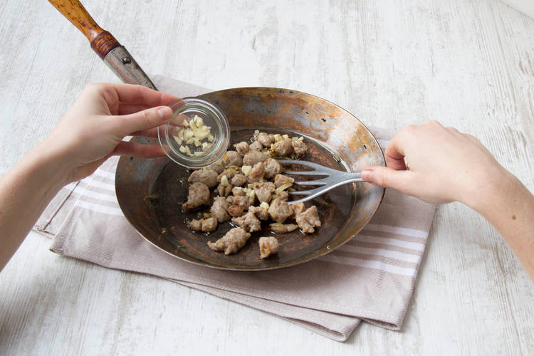 Cook sausage and onion