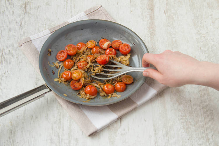 Cook tomatoes until they start to burst